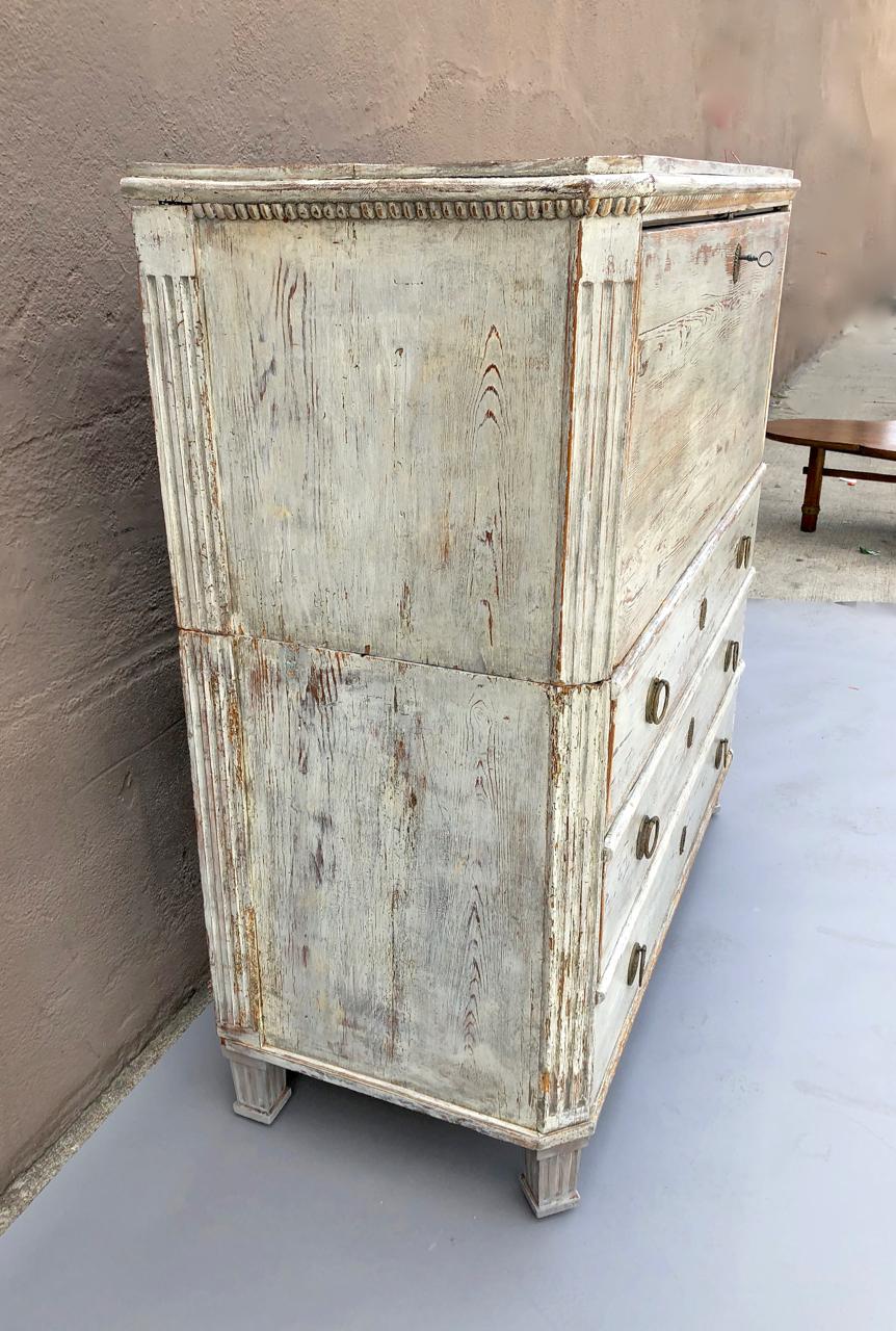 This is a fine example of a Swedish Gustavian late 18th century Secretaire. The two-part structure is very desirable and retains it's original scraped surface and wonderful natural patina. The muted pale gray/blue-gray surface brings out the fine