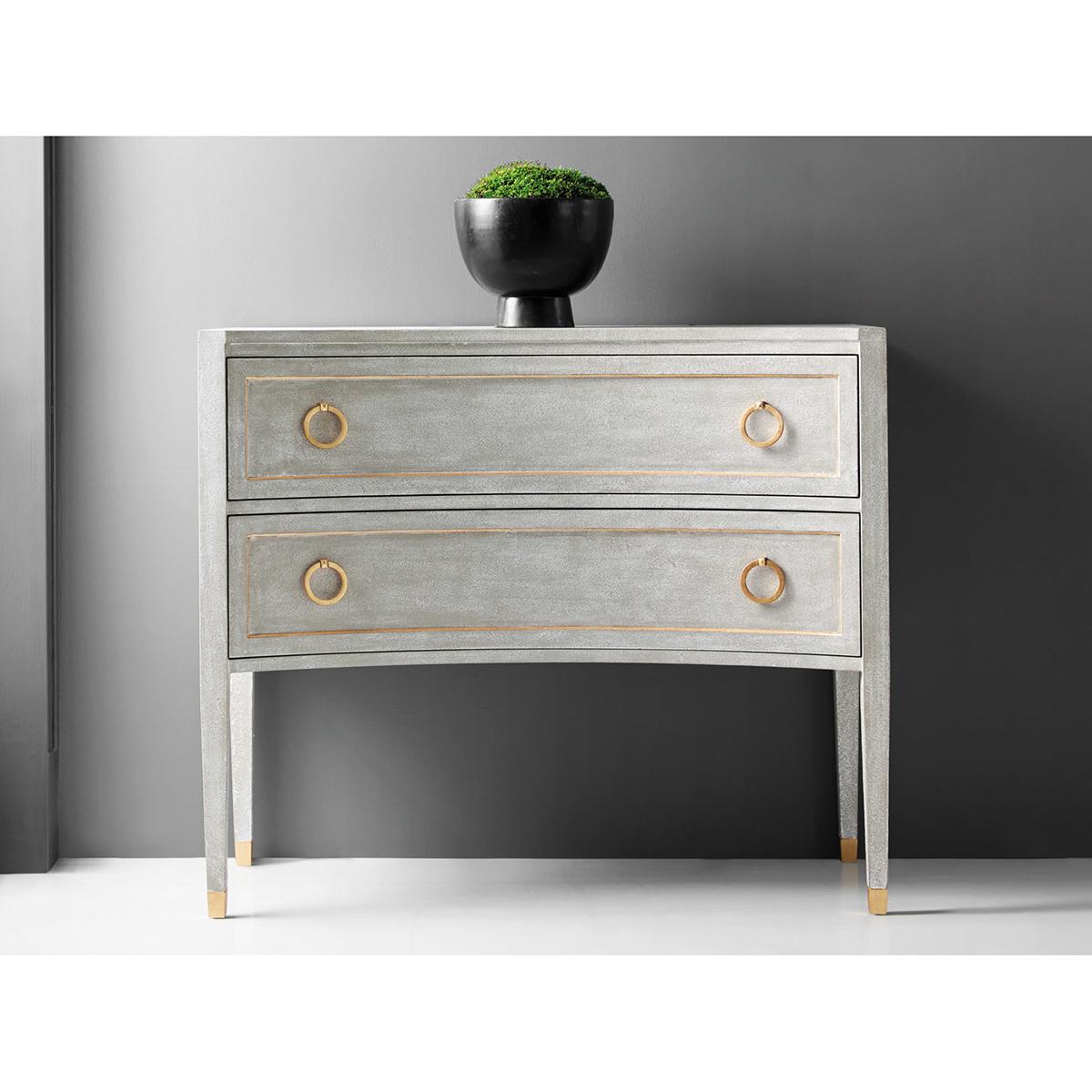 Gustavian Grey Painted Dresser, The Swedish Neo Classic style Gustavian commode with a concave front side, with paneled drawers and sides having gold leaf trim details. The two long drawers with brass ring pull hardware, raised on tapered legs and