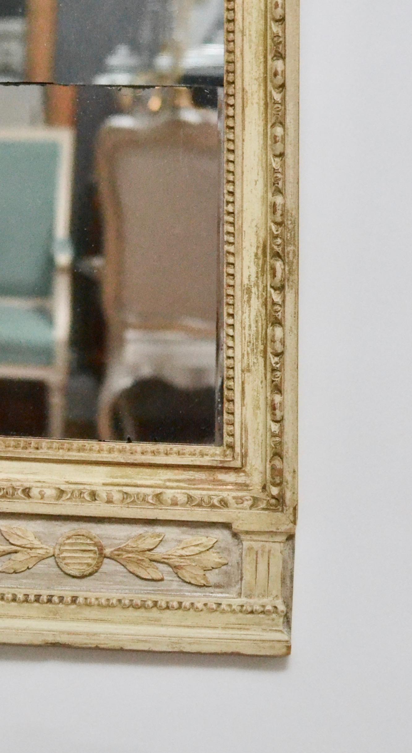 Gustavian giltwood mirror in worn original condition with gouaches made circa 1800.