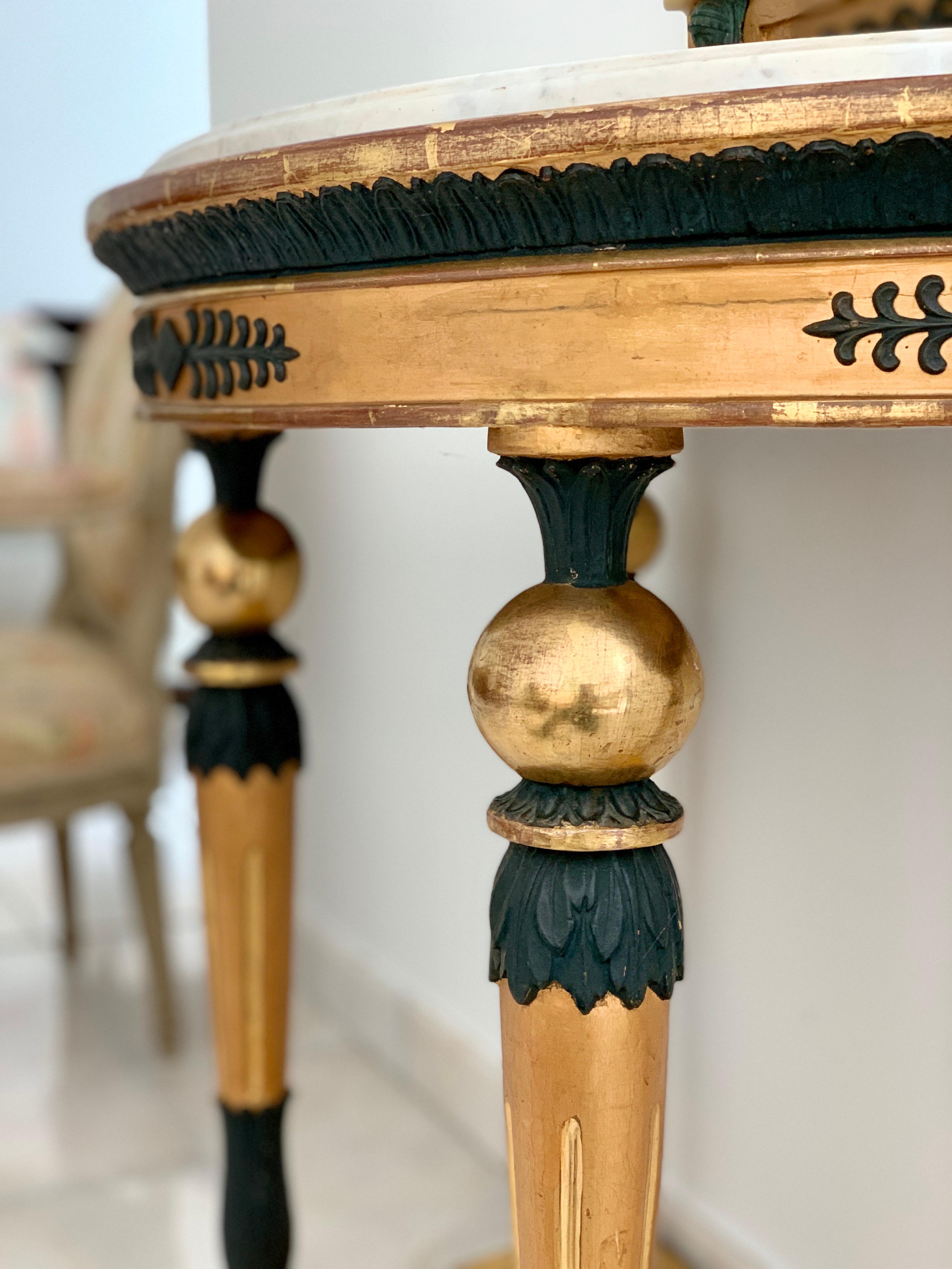 Very decorative set of a Gustavian demilune console table with white marble top and matching pier mirror, signed by one of the leading Stockholm makers Lars Magnus Thiem, (1782-1814). All in giltwood with dark green painted gesso decoration to