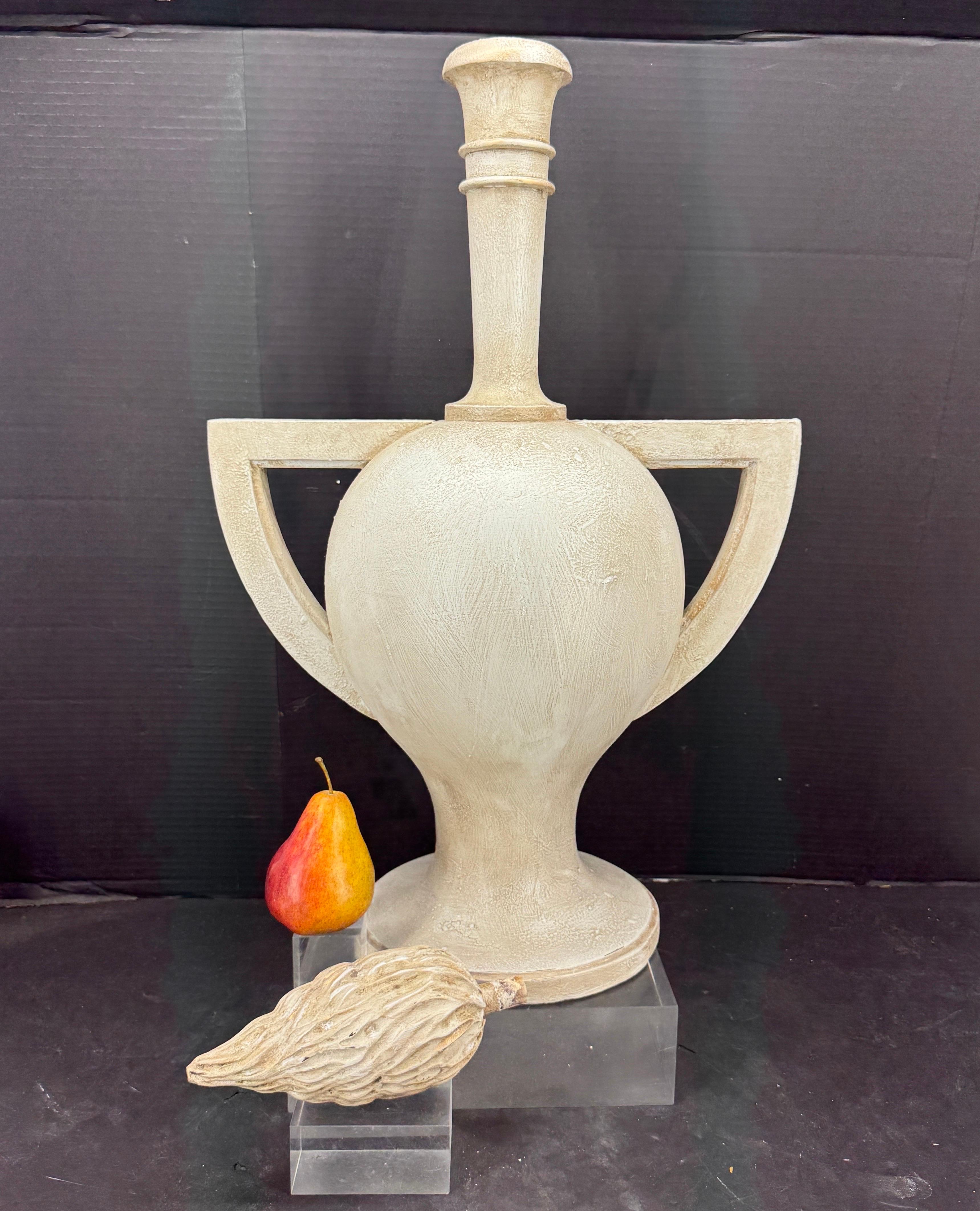 Impressive sculpture of an urn or trophy with removable flame finial. The flame was often used as decorative element in antiques similar to this modern one. The wooden sculpture is presented in a 