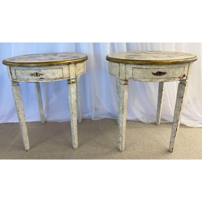 18th/19th Century Gustavian pair of end, side tables. The pair having been later hand pained in the Piero Fornasetti fashion. Each on sturdy bases of worn design this magnificently pair of painted tables depict opposing bare chested Greek Gods with