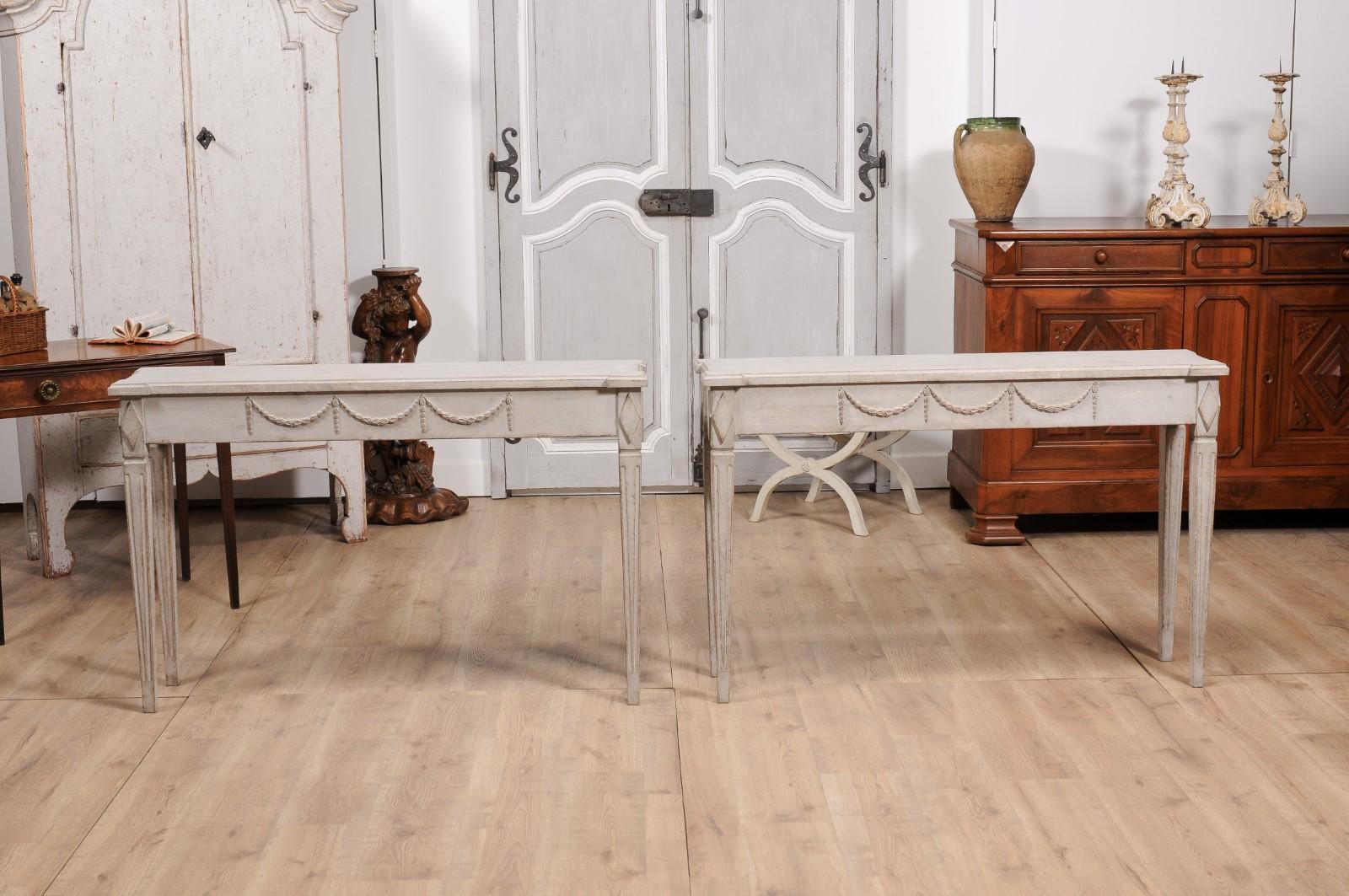 Wood Gustavian Period 1810s Swedish Gray Painted Console Tables with Carved Garlands For Sale