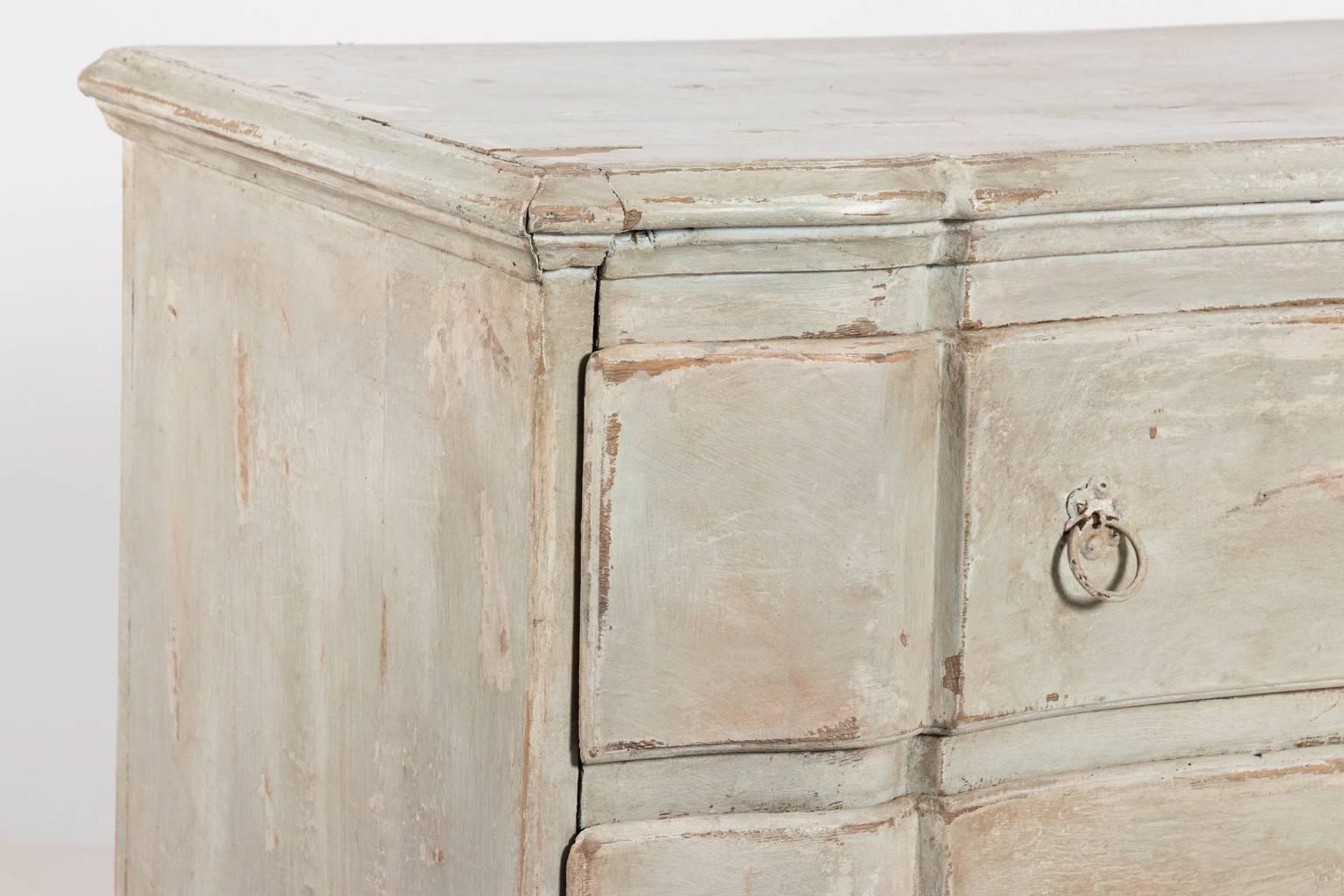 Mid-20th century vintage Gustavian style serpentine three drawer chest in a dove grey antiqued finish.
 