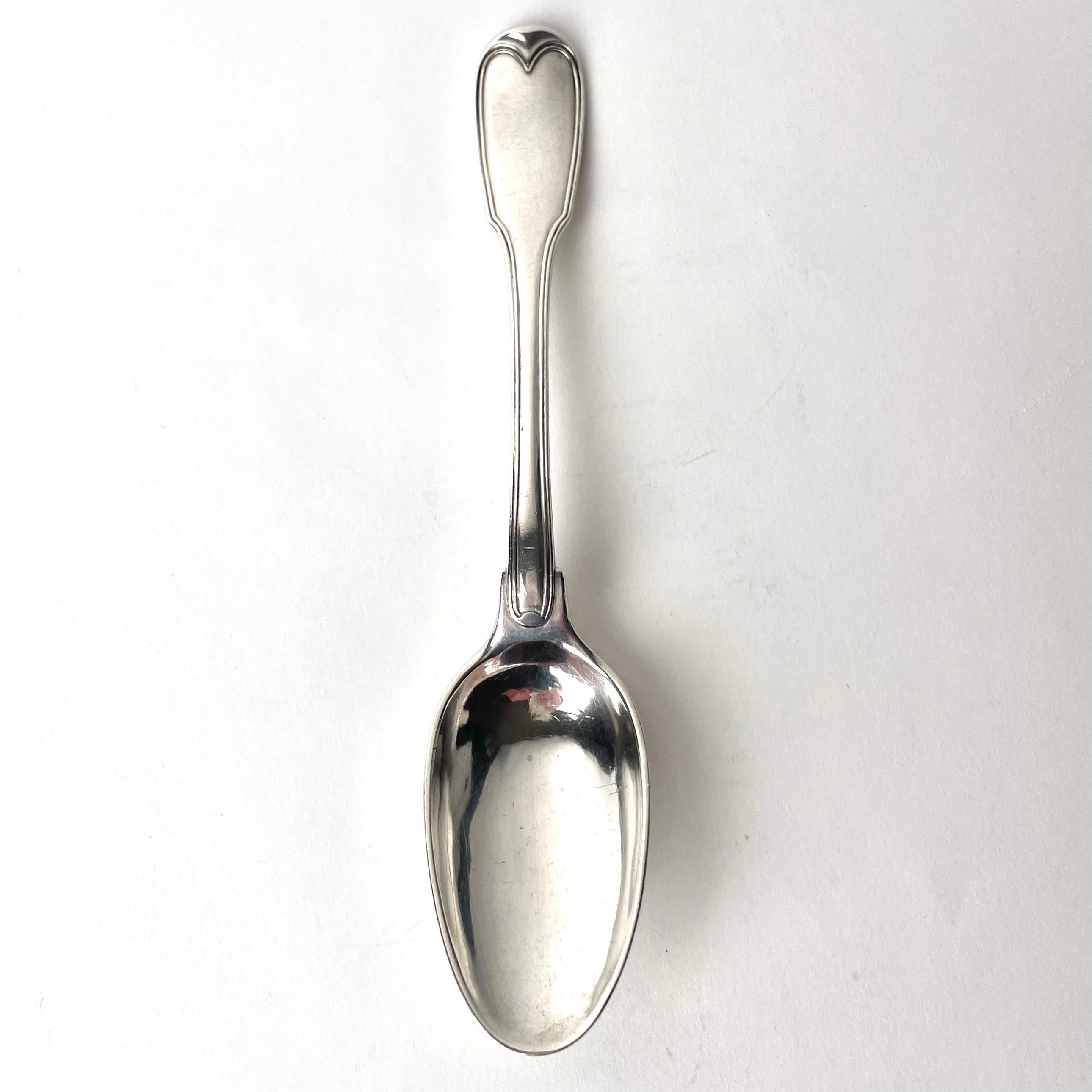 Gustavian silver spoon by Arvid Floberg (1730-1804), Stockholm, Sweden dated 1785(C2) with baronial coat of arms. Rare and of extremely high quality. Simple beauty.

Wear consistent with age and use.