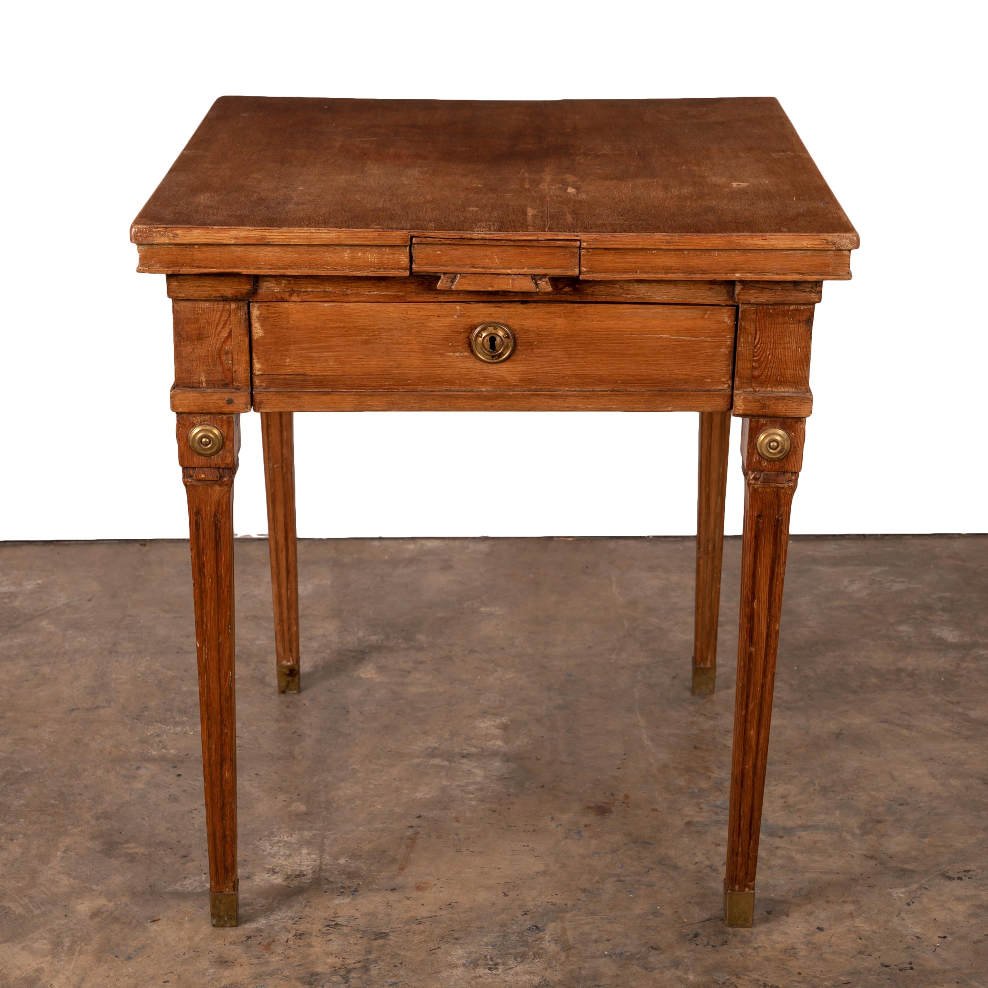 A fine Gustavian period ‘spelbord’ game table, 18th century.

Four small drawers on each side with one larger drawer; original brasses.

26 ¼ inches wide by 26 ¼ inches deep by 30 inches tall

