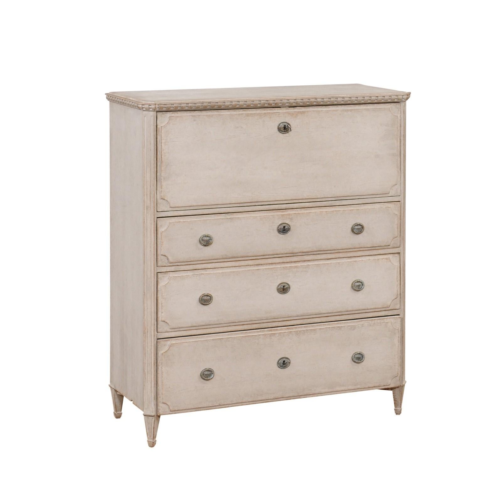 A Swedish Gustavian style drop front secretary from circa 1840 with gray painted finish, writing area and three graduated drawers. This Swedish Gustavian style drop-front secretary, crafted around 1840, is a masterpiece of classical elegance. Its