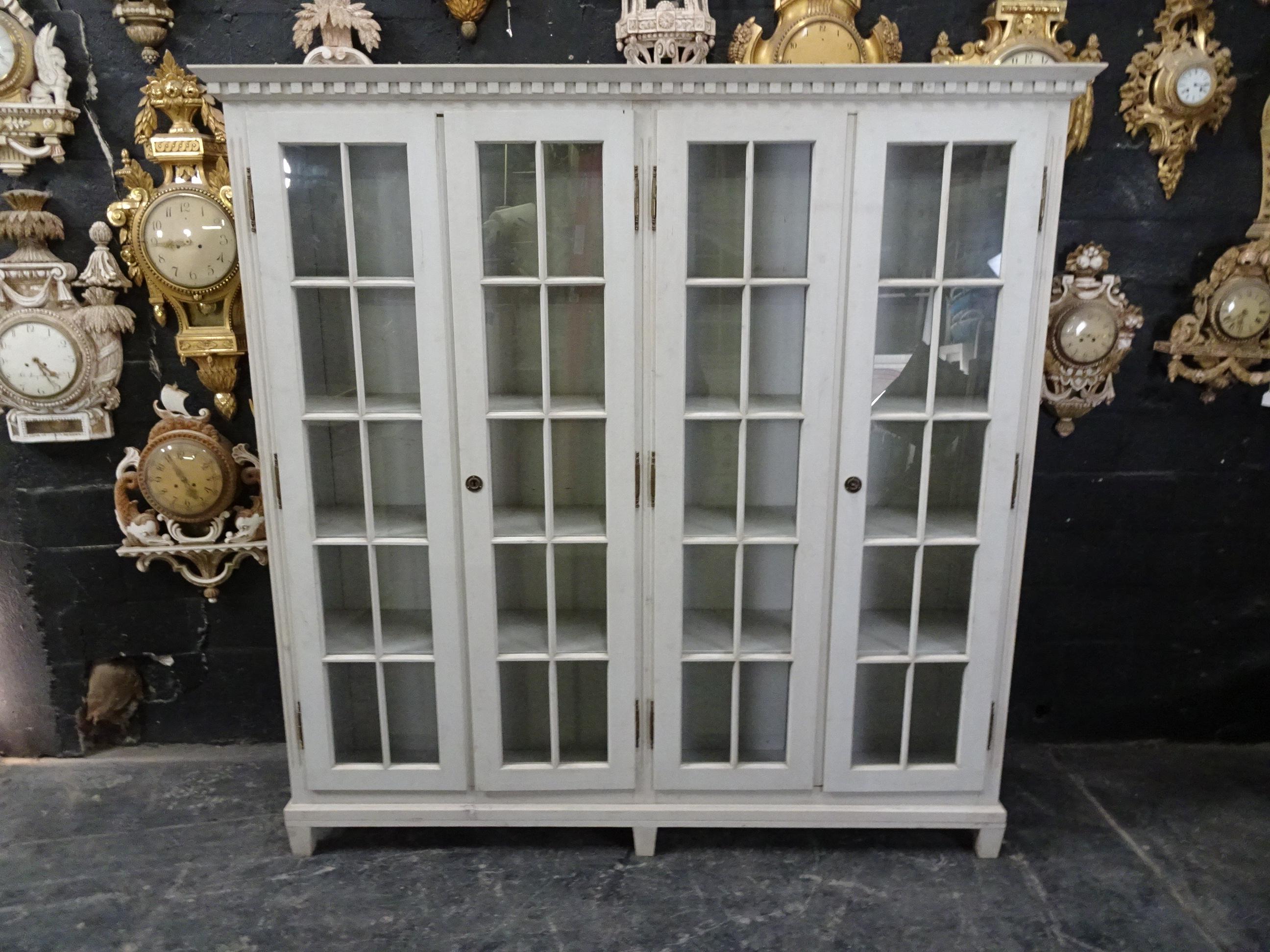 This is a Gustavian style 4-door glass cabinet, it’s been restored and repainted with milk paints 