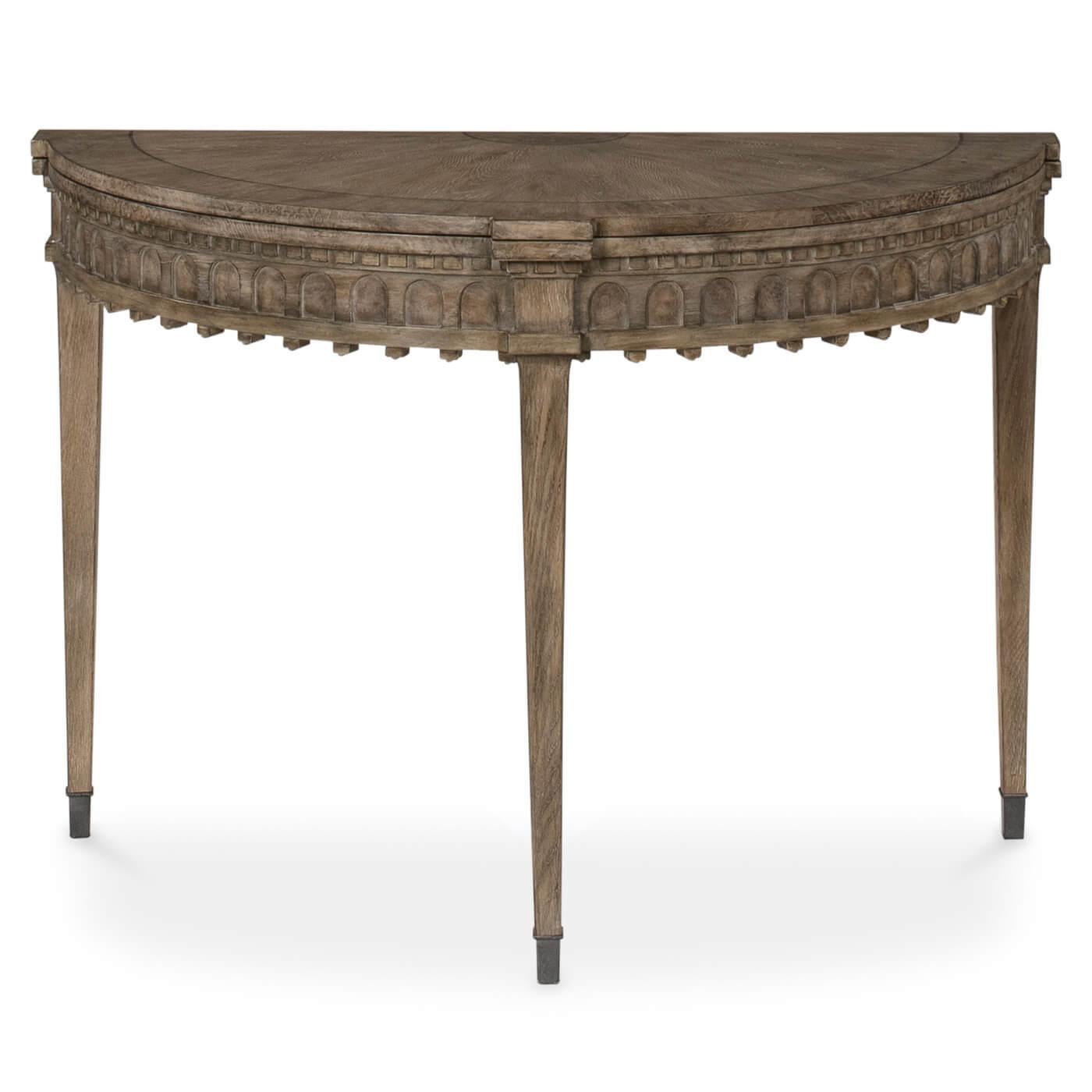 A Gustavian-style flip-top game table. The top of this table is veneered in radial matched knotty oak with a chestnut burl border and center medallion. It is framed with black inlay and has a heather gray finish. 

This beautiful table has an