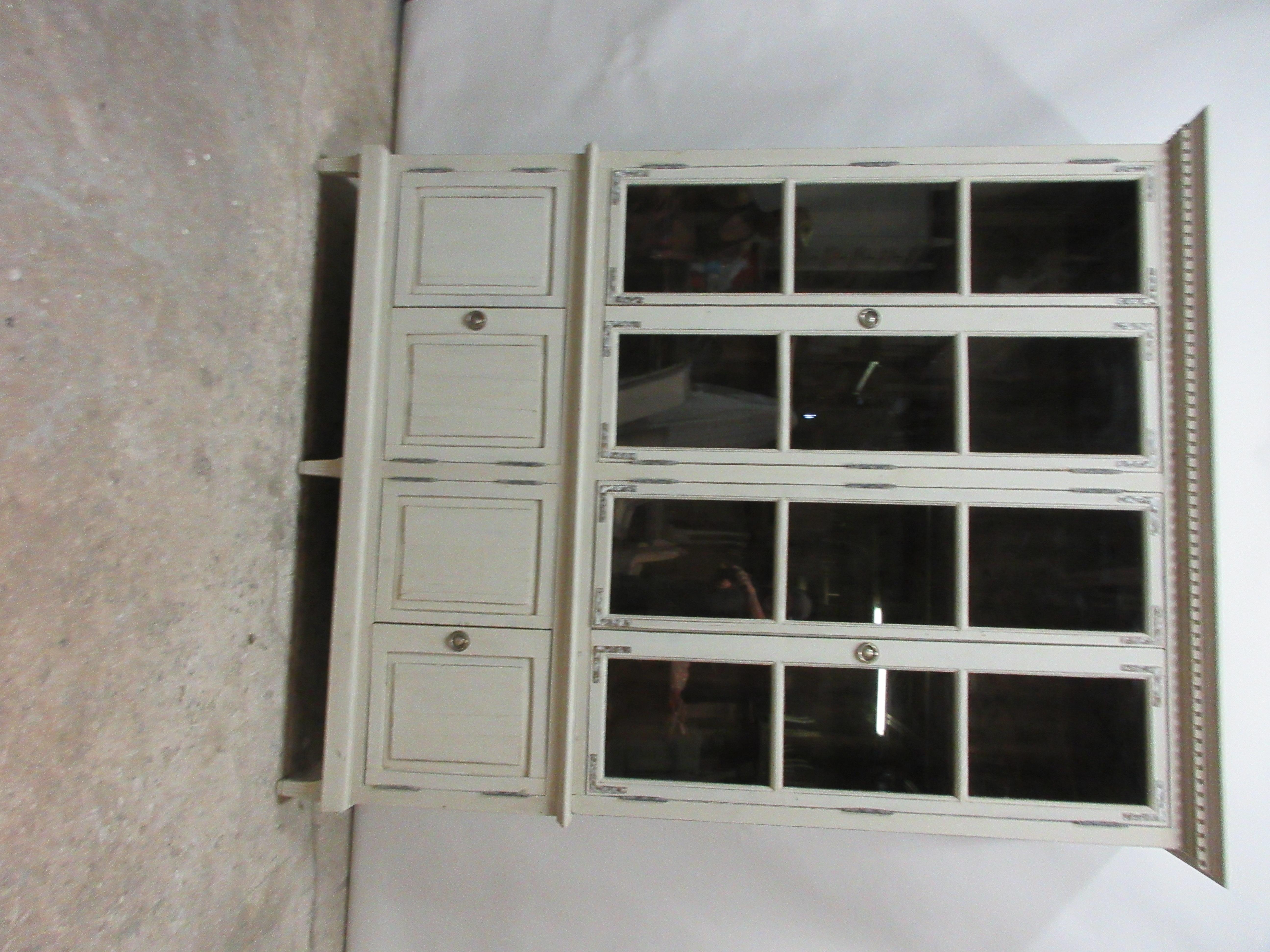 This is a Gustavian style glass top Hutch, it has been restored and repainted with milk paints 