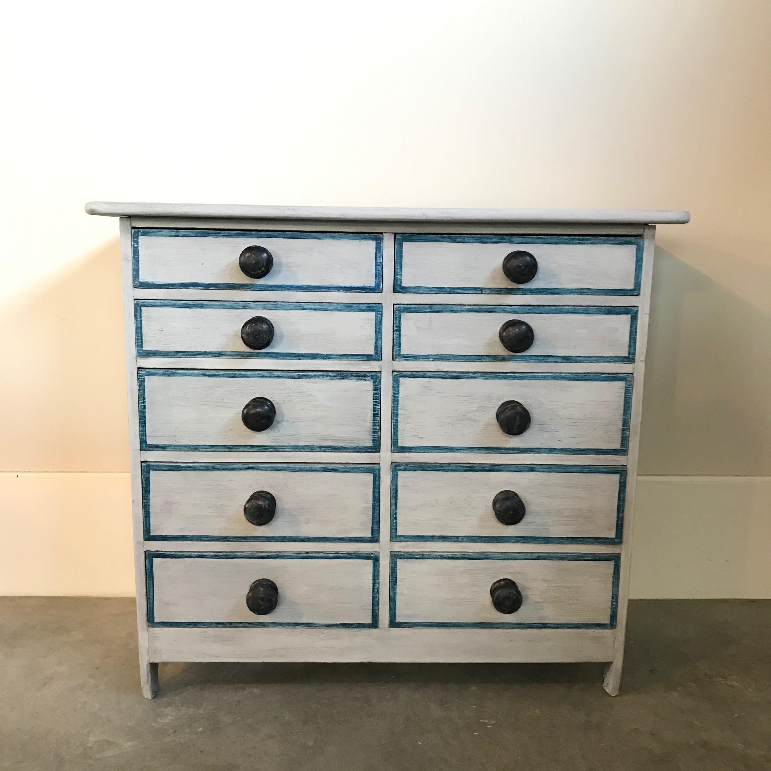 Charming Gustavian chest of drawers having 10 drawers and later paint in a soft grey and teal blue trim.
#3565.
     