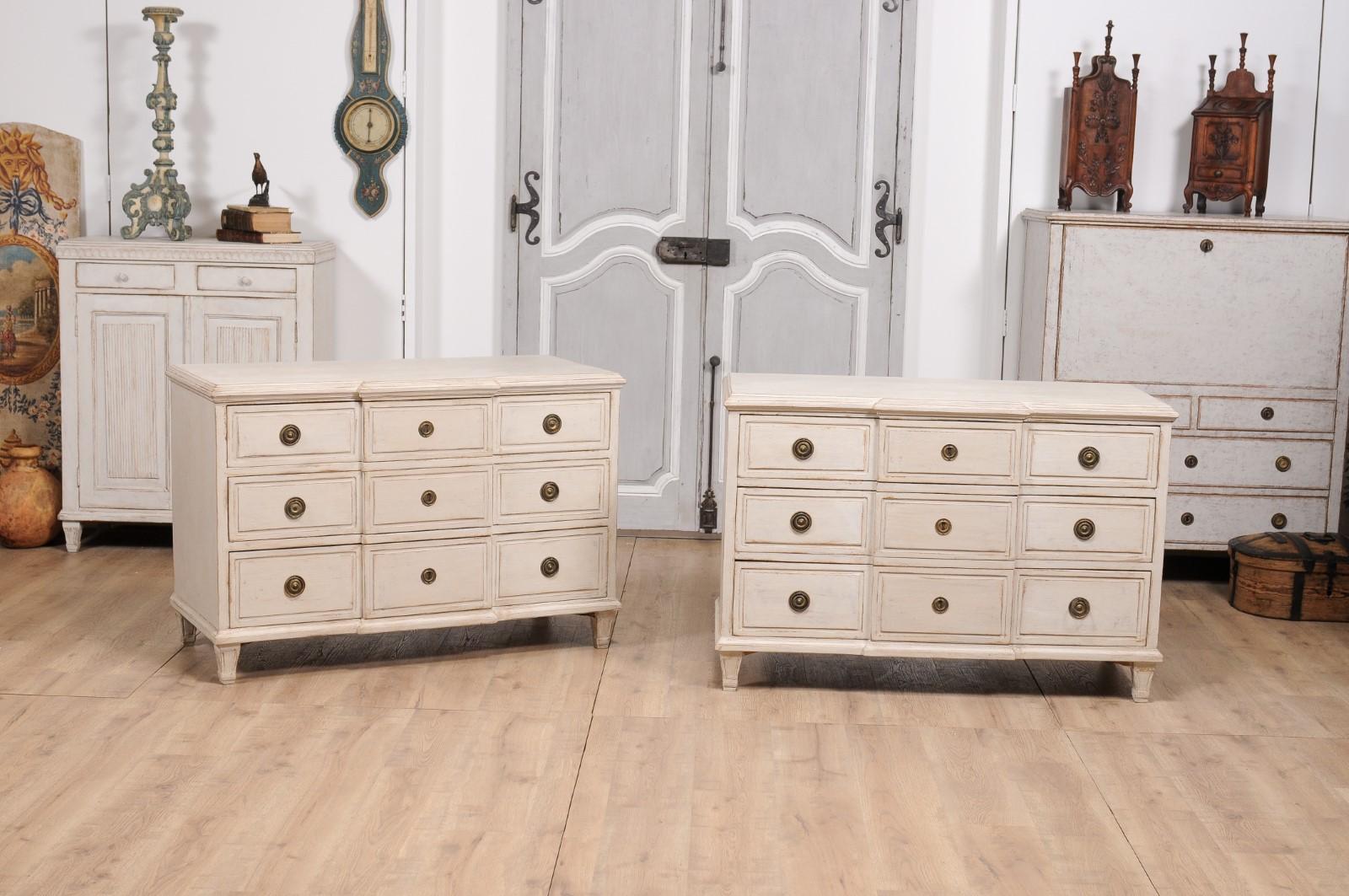 Carved Gustavian Style Swedish Off White Painted Three-Drawer Breakfront Chests, a Pair For Sale