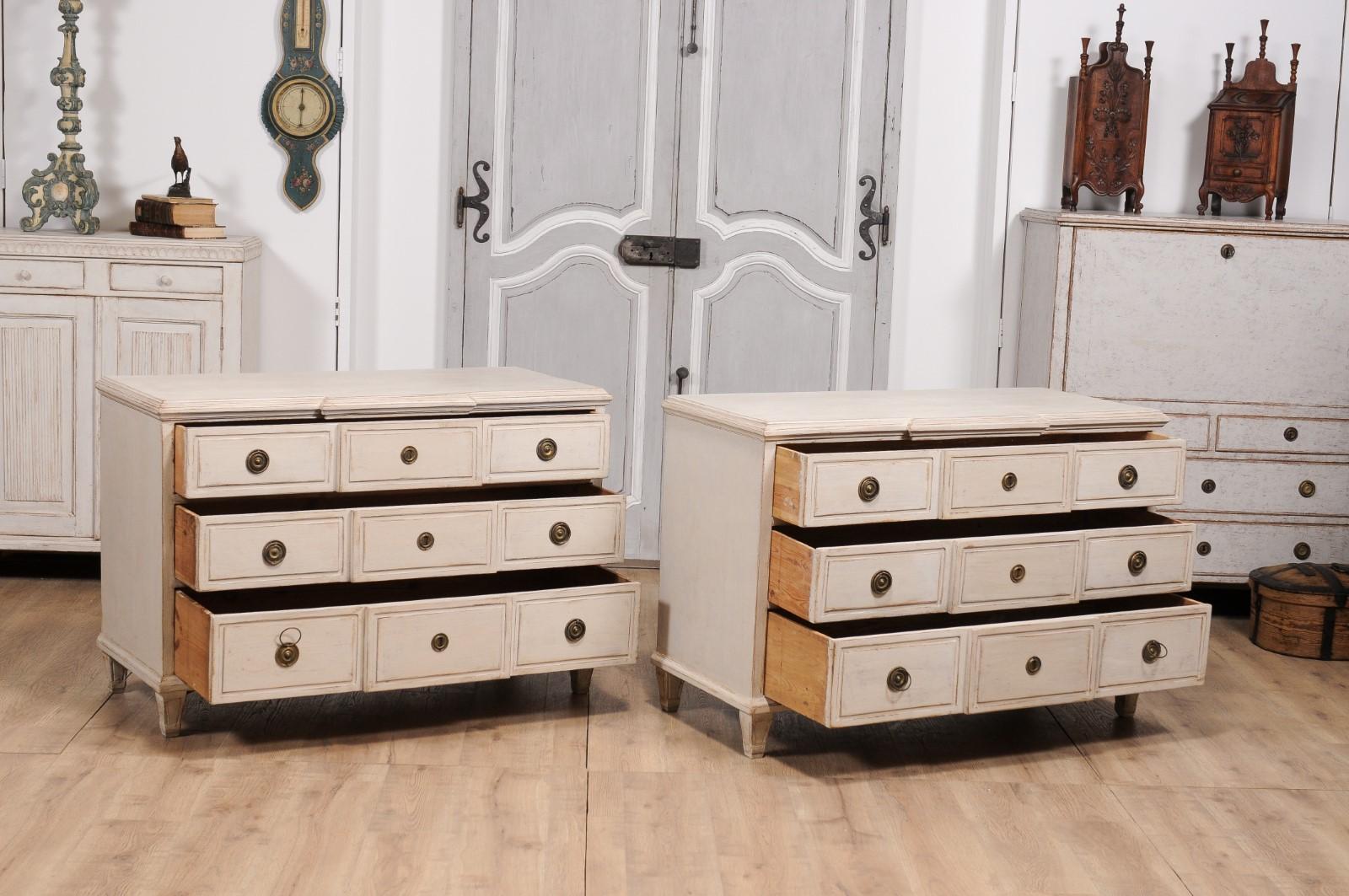 20th Century Gustavian Style Swedish Off White Painted Three-Drawer Breakfront Chests, a Pair