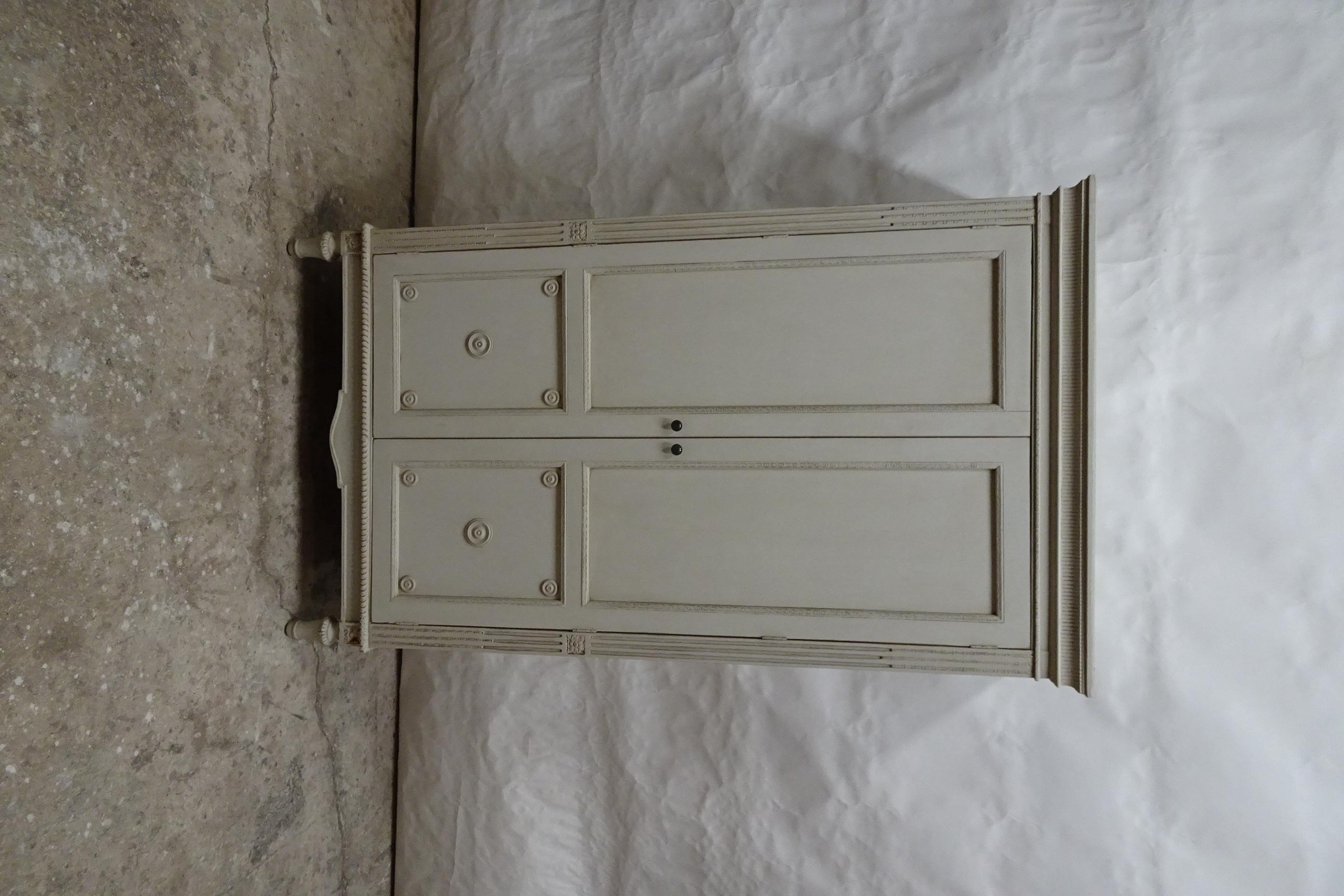 This is a unique Gustavian Style Wardrobe , its been restored and repainted with Milk Paints 