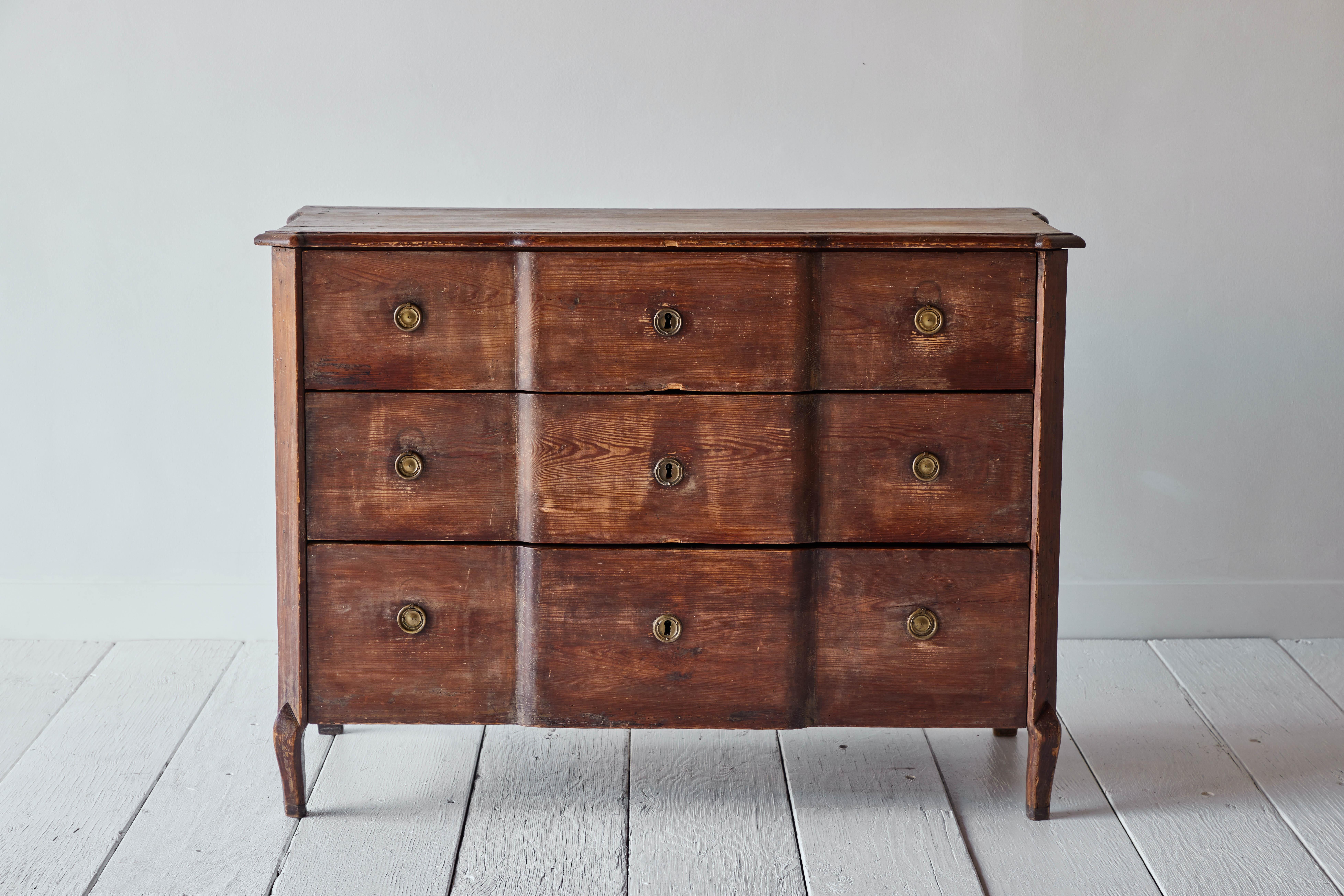 This elegant chest of drawers is a beautiful example of Swedish adaptation of the French Louis XVI style during the reign of King Gustav III of Sweden. The three drawer dresser stands on four pointed feet and has its original bronze fitting and