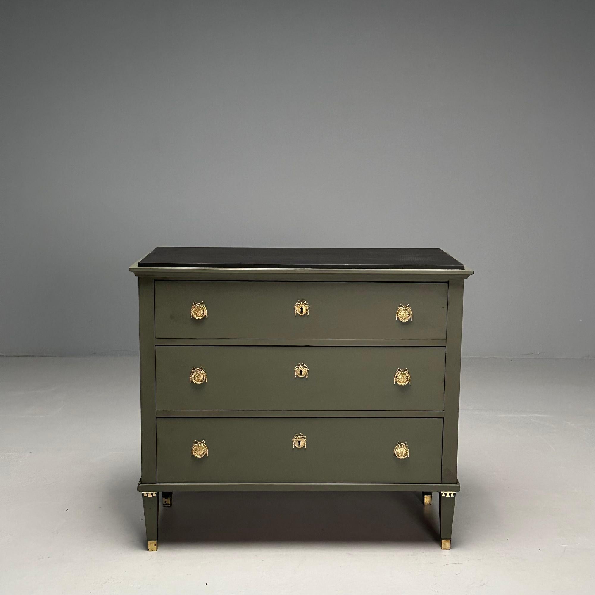 Gustavian, Swedish Commode, Green Paint, Pinewood, Brass, Sweden, 1970s

Gustavian chest of drawers in the Louis XVI style designed and produced in Sweden in the later half of the 20th century. This example having a later green painted finish, three
