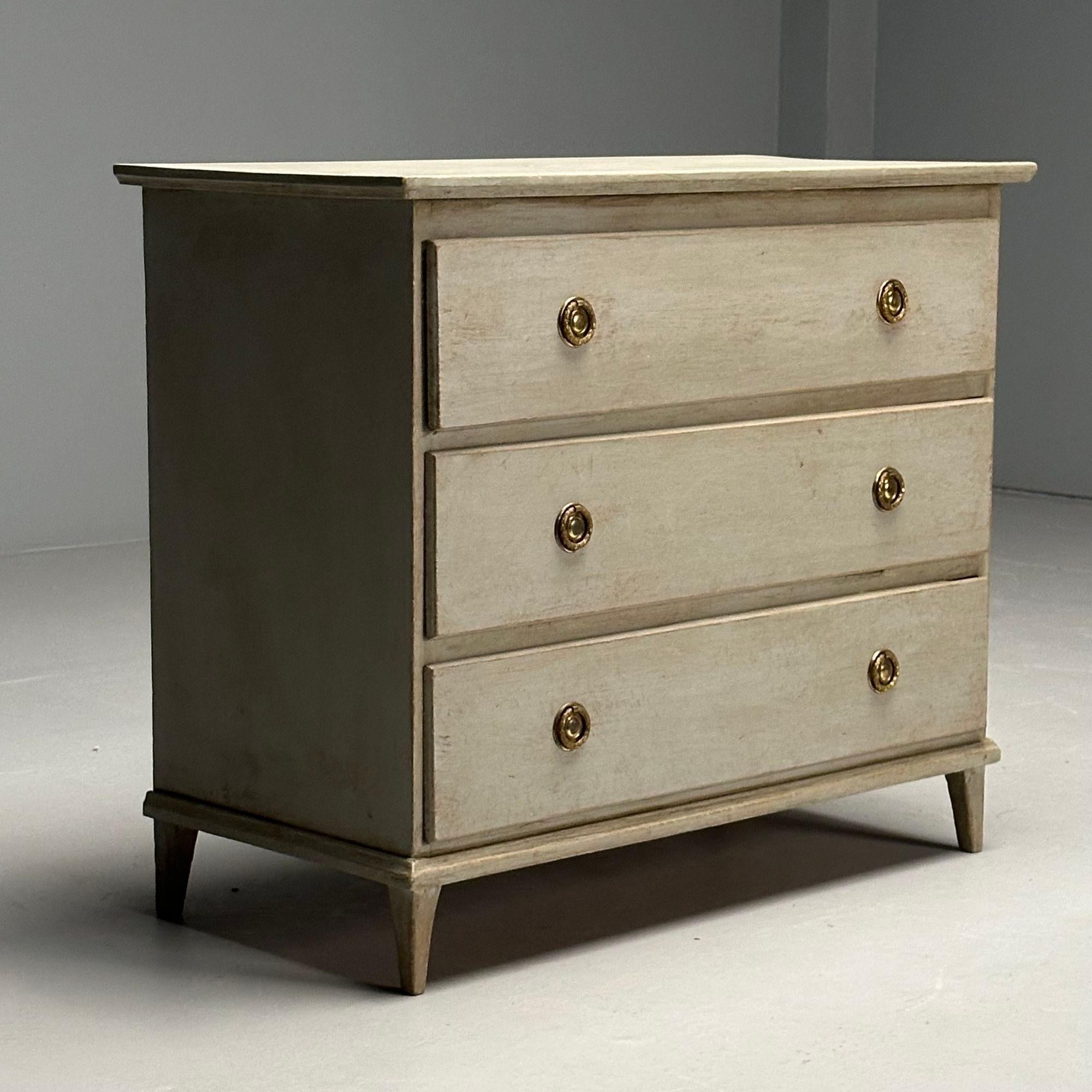 Gustavian, Swedish Commode or Dresser, Grey Paint Distressed, Brass, Sweden, 1940s

Gustavian chest of drawers designed and produced in Sweden circa 1940s. This example features a gray paint distressed finish and three dovetailed drawers with brass