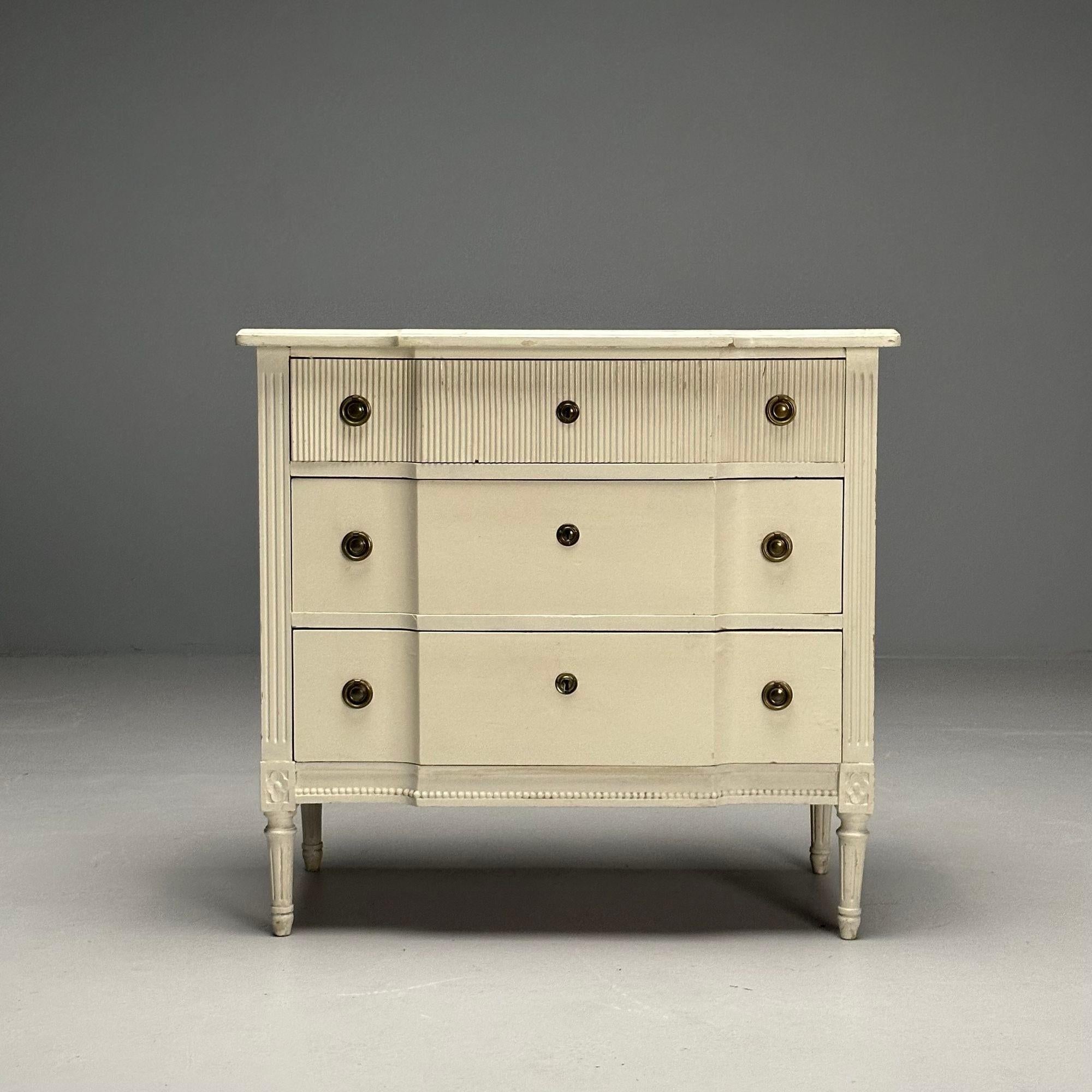 Gustavian, Swedish Commode, Louis XVI Style, White Paint Distressed, Sweden, 1990s

Louis XVI style dresser or cabinet designed and produced in Sweden in the later half of the 20th century. This example has a white paint distressed finish, reeded