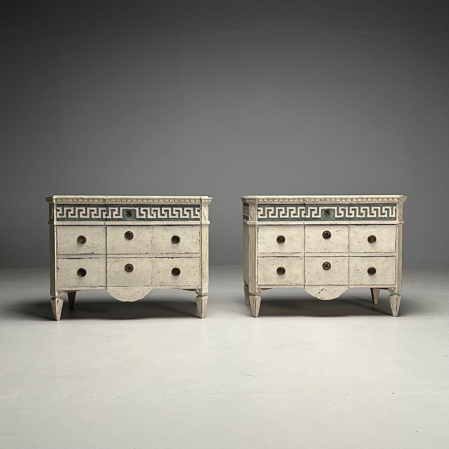 Gustavian, Swedish Painted Commodes or Nightstands, Greek Key Motif, White and Blue Paint Distressed

Pair of Gustavian commodes or nightstands designed and produced in Sweden in the early part of the 20th century. The pair having block front cases