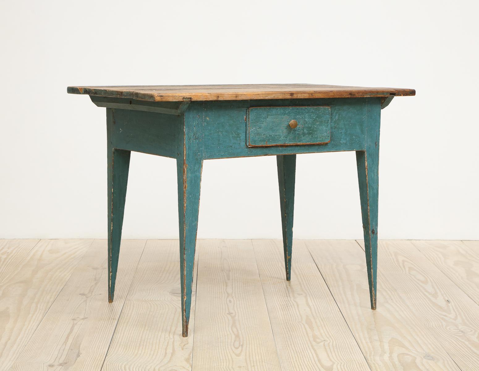 Swedish Gustavian Allmoge table with center drawer, origin: Sweden, circa 1790, original blue / green paint and black top. Pure form on elegantly tapered legs. Wonderful writing table / desk or side table.

Allmoge is the Swedish word referring to