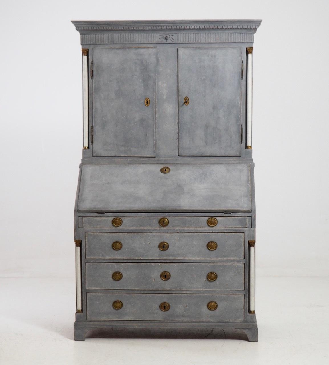 Gustavian three-part bureau, with bronze mountings and white columns, circa 1810.