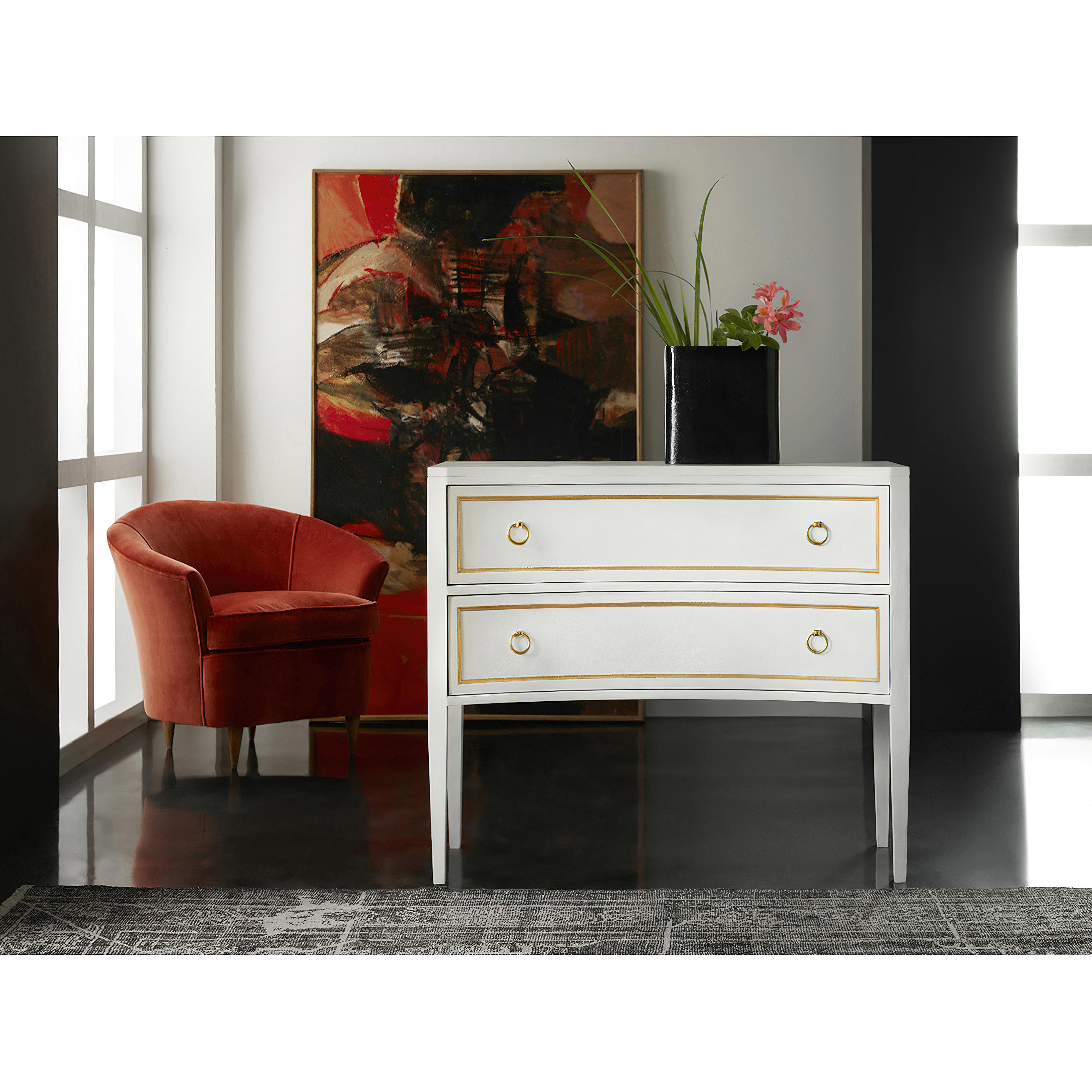 Gustavian White Painted commode, The Swedish Neo Classic style Gustavian commode with a concave front side, with paneled drawers and sides having gold leaf trim details. The two long drawers with brass ring pull hardware, raised on tapered legs and