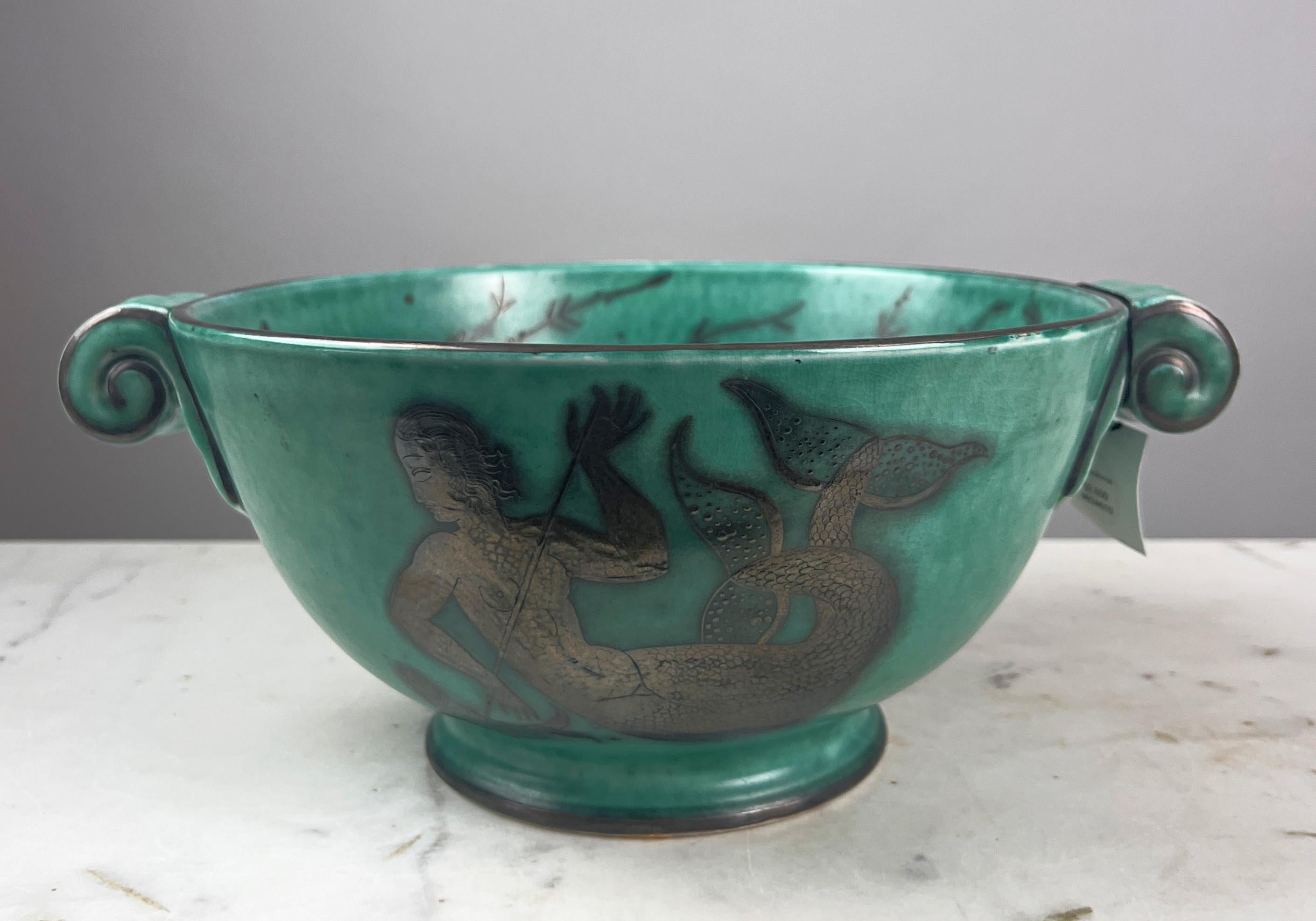 Gustavsberg Argenta was a series of stoneware objects designed by Wilhelm Kåge for the Gustavsberg pottery company in Sweden.

Wilhelm Kåge (1889-1960) is one of the most well-known representatives of the illustrious Swedish ceramic design of the