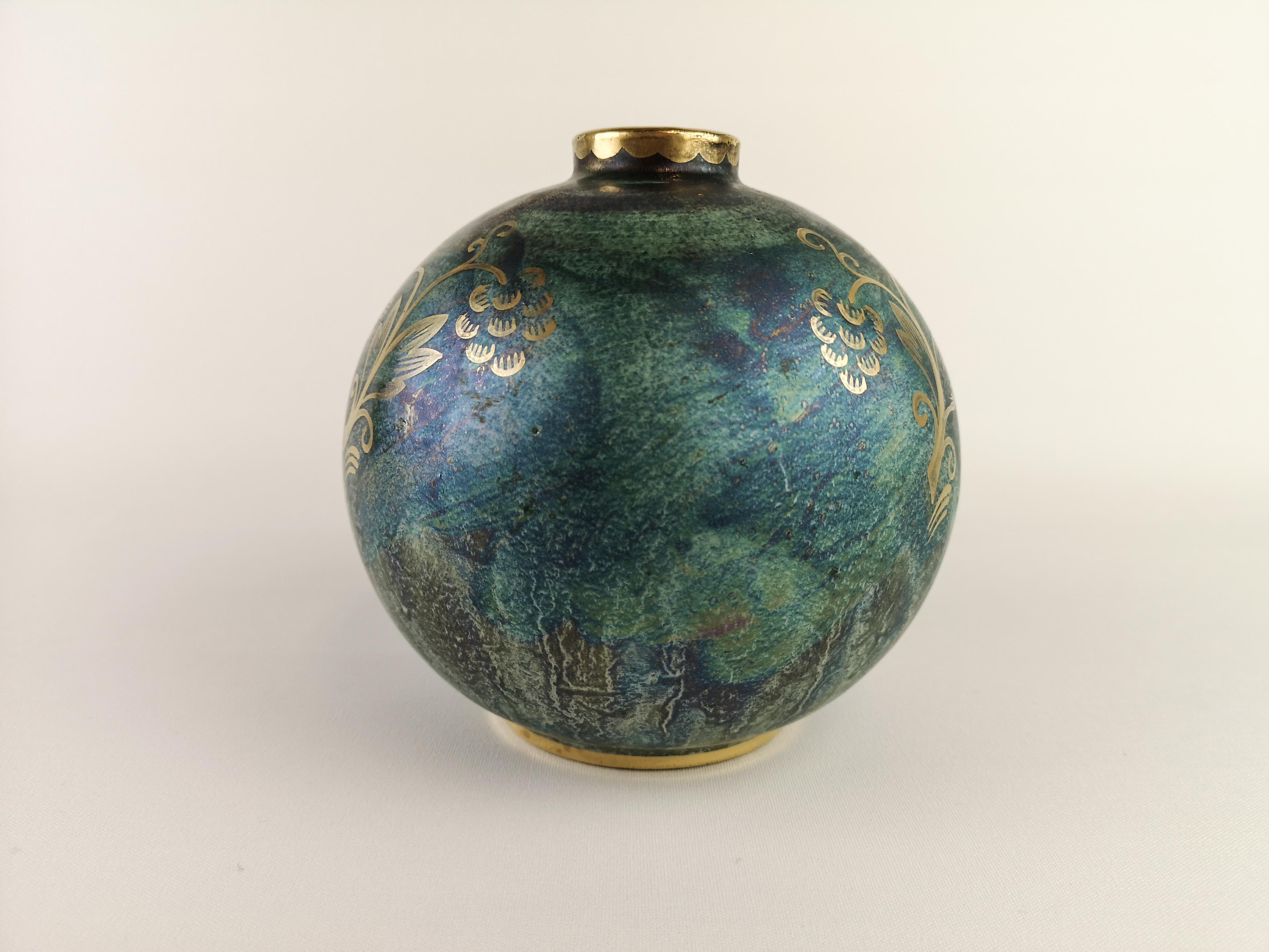 A wonderful globe vase created by Josef Ekberg and manufactured by Gustavsberg Sweden in 1920s. Wonderful Green Glaze with hand-painted gold pattern on the vase. 

Vase in excellent condition.
