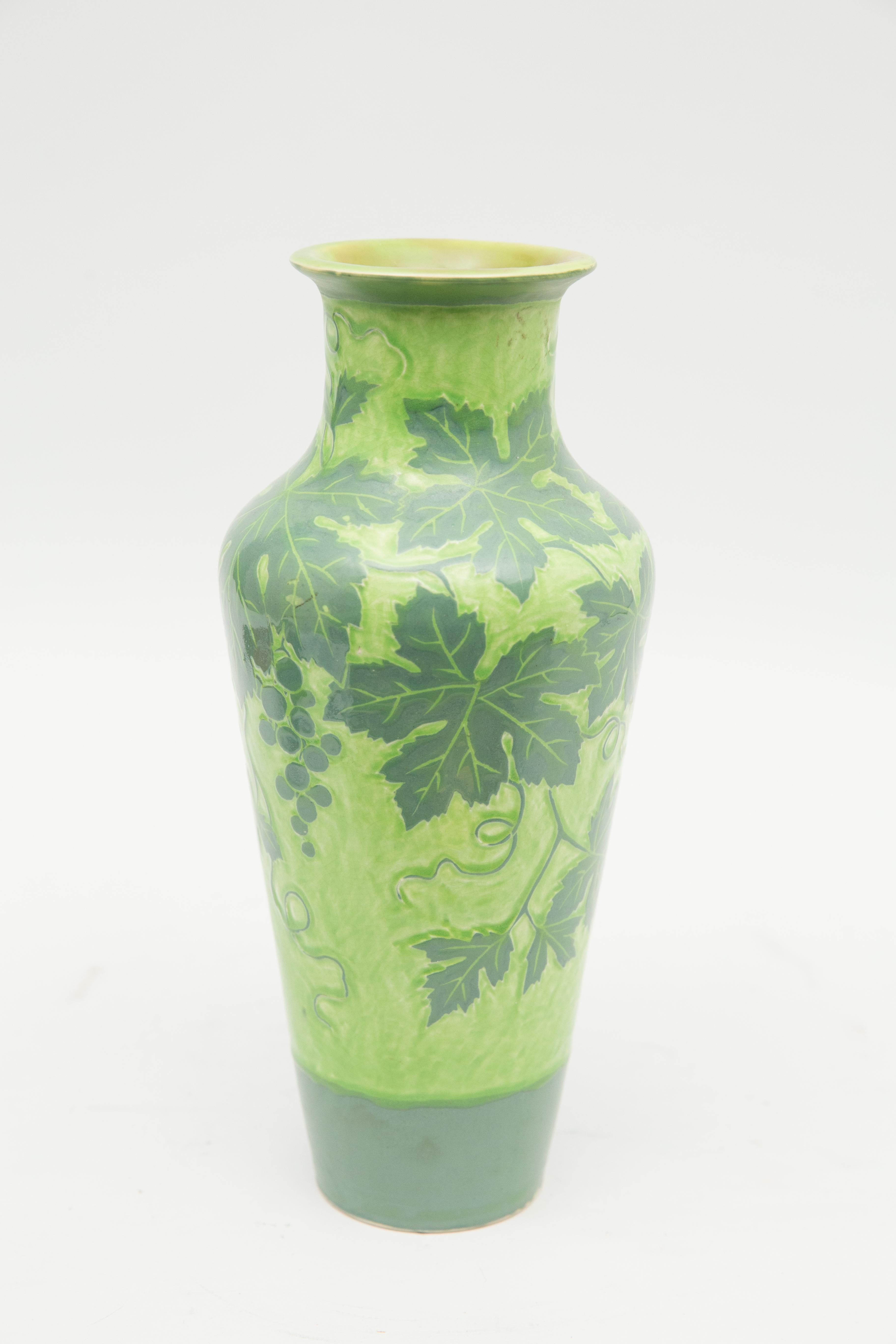 Offered is a fine example of Art Nouveau Gustavsberg’s Scraffito art pottery. The vase is cut back in curvilinear form maple leaf motif. The vase was designed by Scraffito is made by applying layers of tinted clay in contrasting colors to a