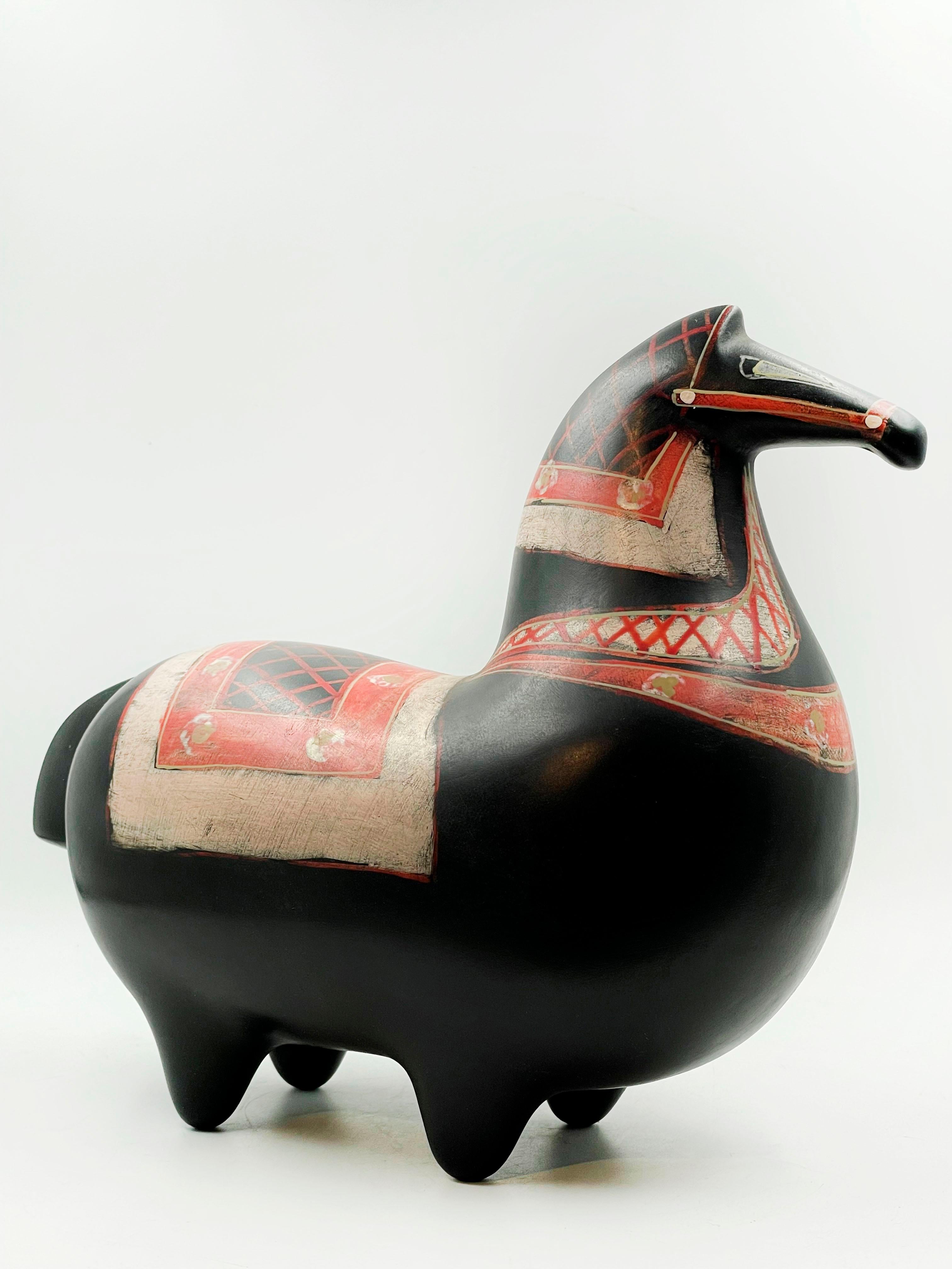 Beautiful Gustavsberg Sweden style racehorse piece in black with orange and veige painted details
Measures:
Height: 20 centimeters
Length: 25 centimeters