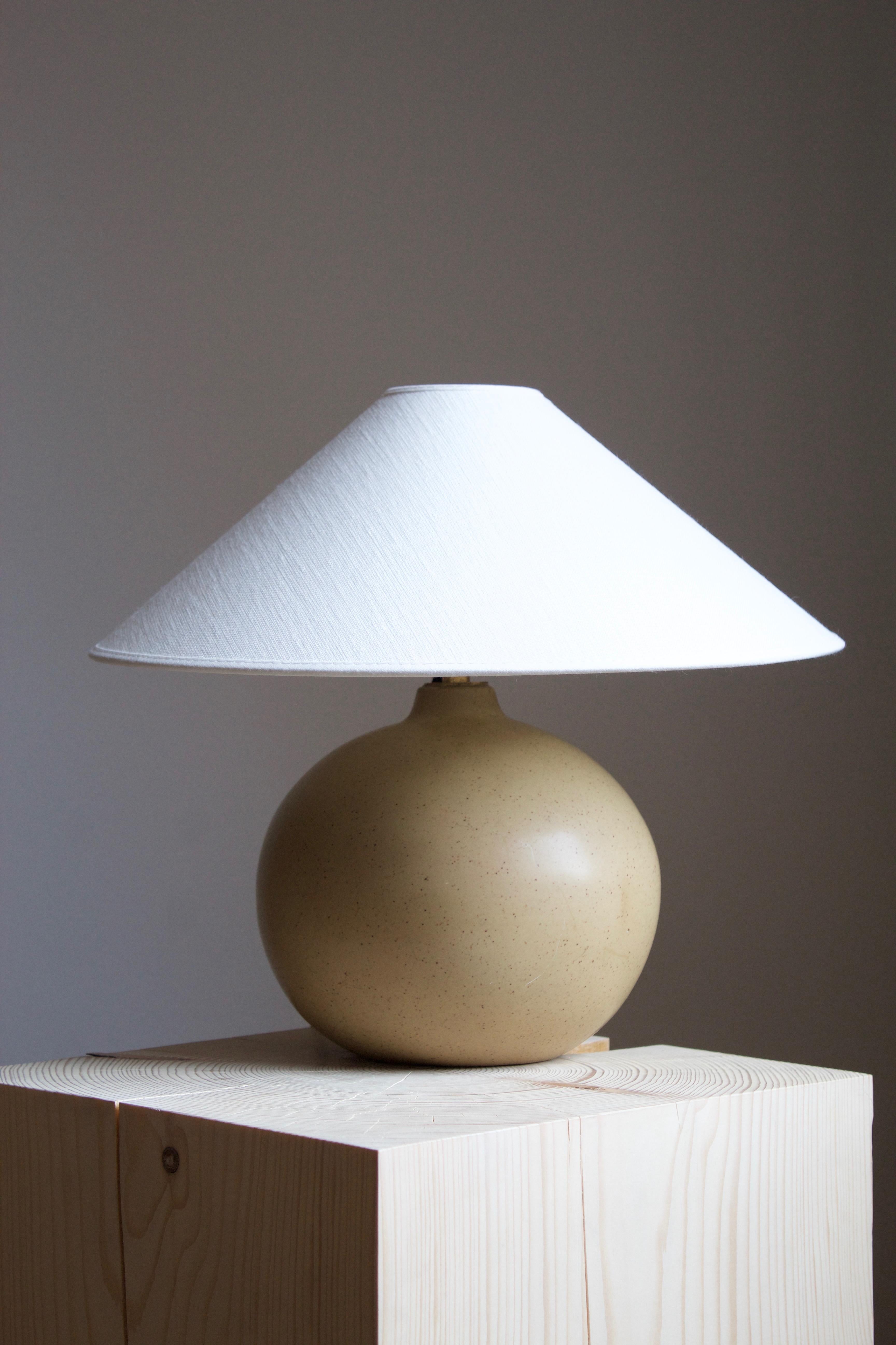 A table lamp, design and production attributed to Gustavsberg, Sweden, 1950s. Unmarked.

Stated dimensions exclude lampshade, height include socket. Sold without lampshade.