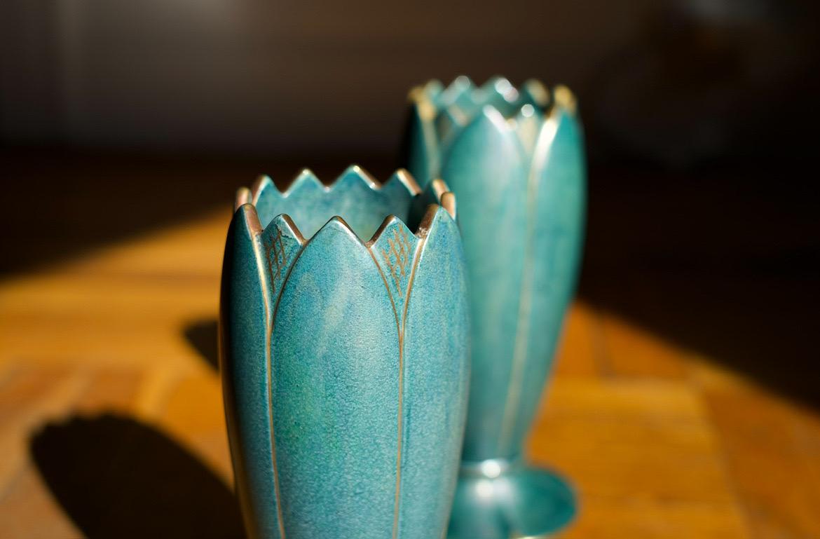 Green ceramic vases By Josef Ekberg Gustavsberg, Sweden 1930 in excellent condition quartz colored with gold ornament surround the top of the rim and the foot . 
Surface has a color play like a pearl.
Two identical vases are available.