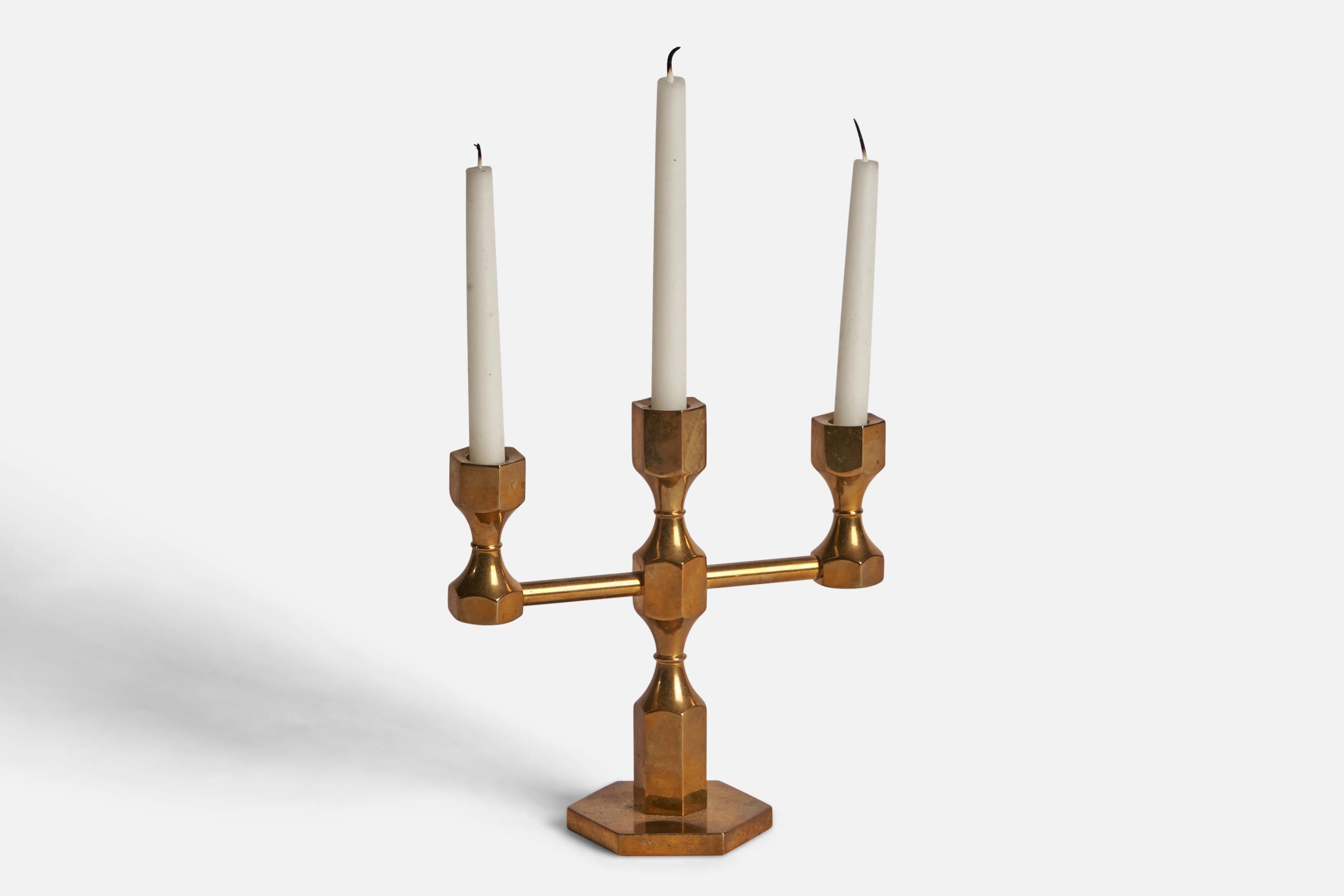 A brass candelabra designed and produced by Gusum Metallslöjden, c. 1970s.

Holds 0.45” diameter candles
