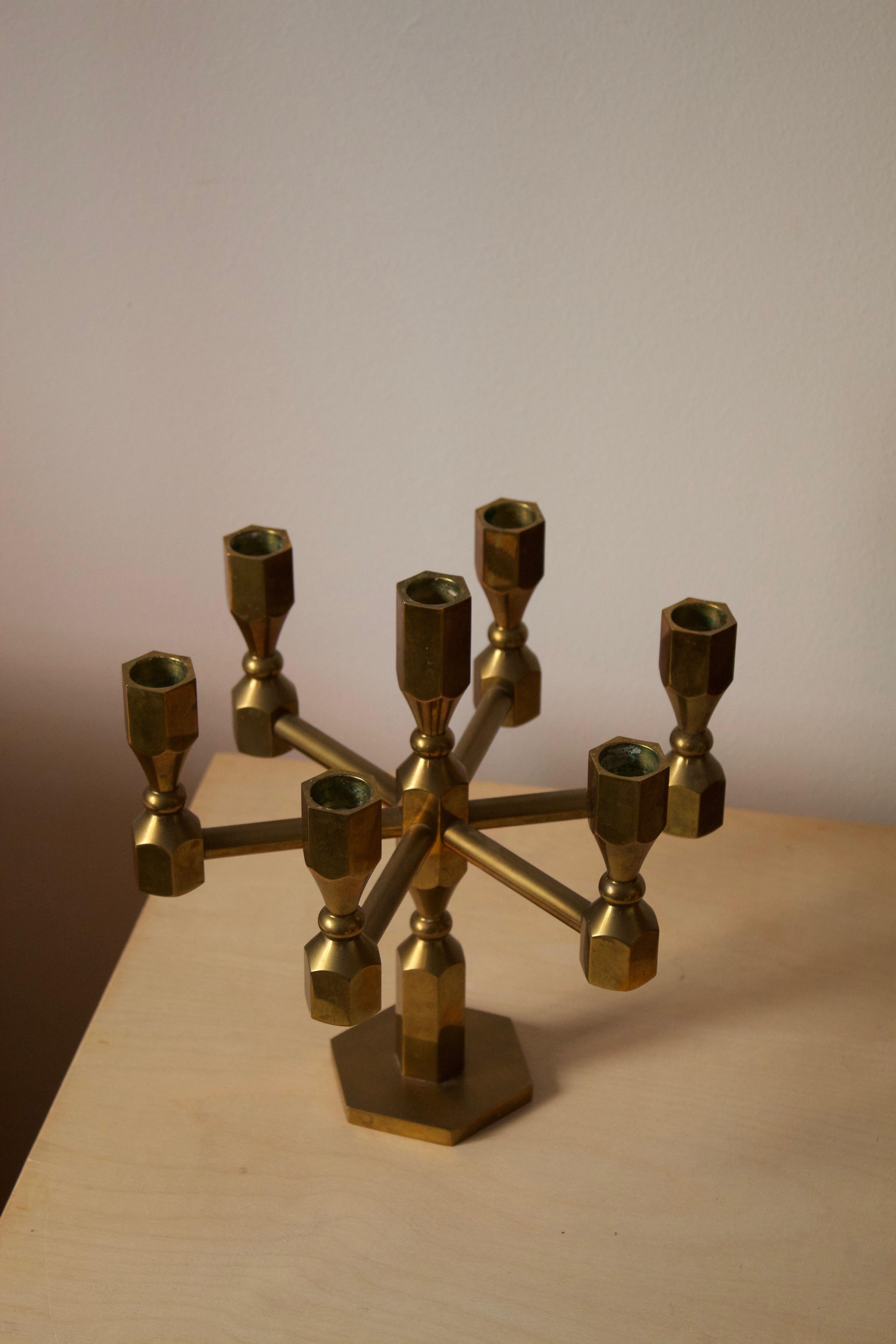 A candelabrum. Design and production by Metallslöjden Gusums Bruk, Sweden, 1984. In heavy alloy brass.
