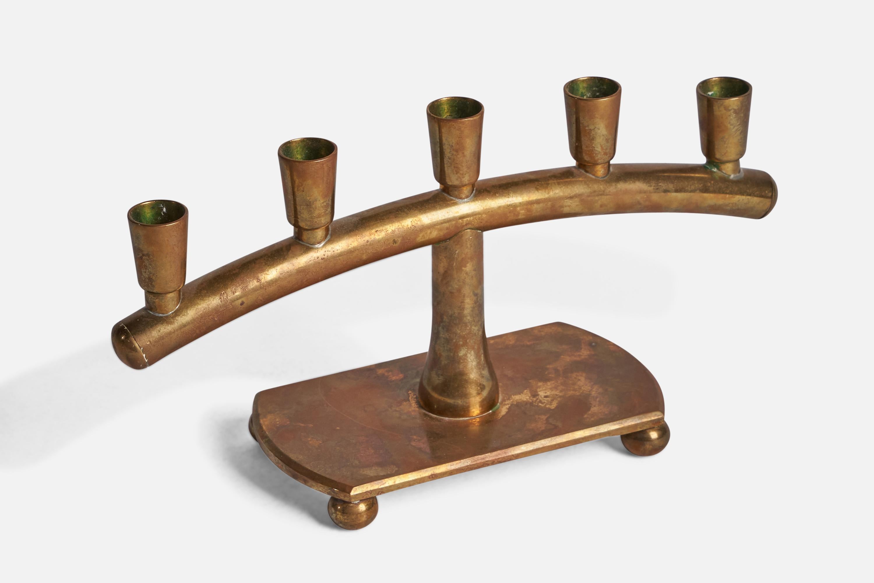 A brass candelabra attributed to Gusums Bruk, Sweden, c. 1940s.

Hold 0.75” diameter candles