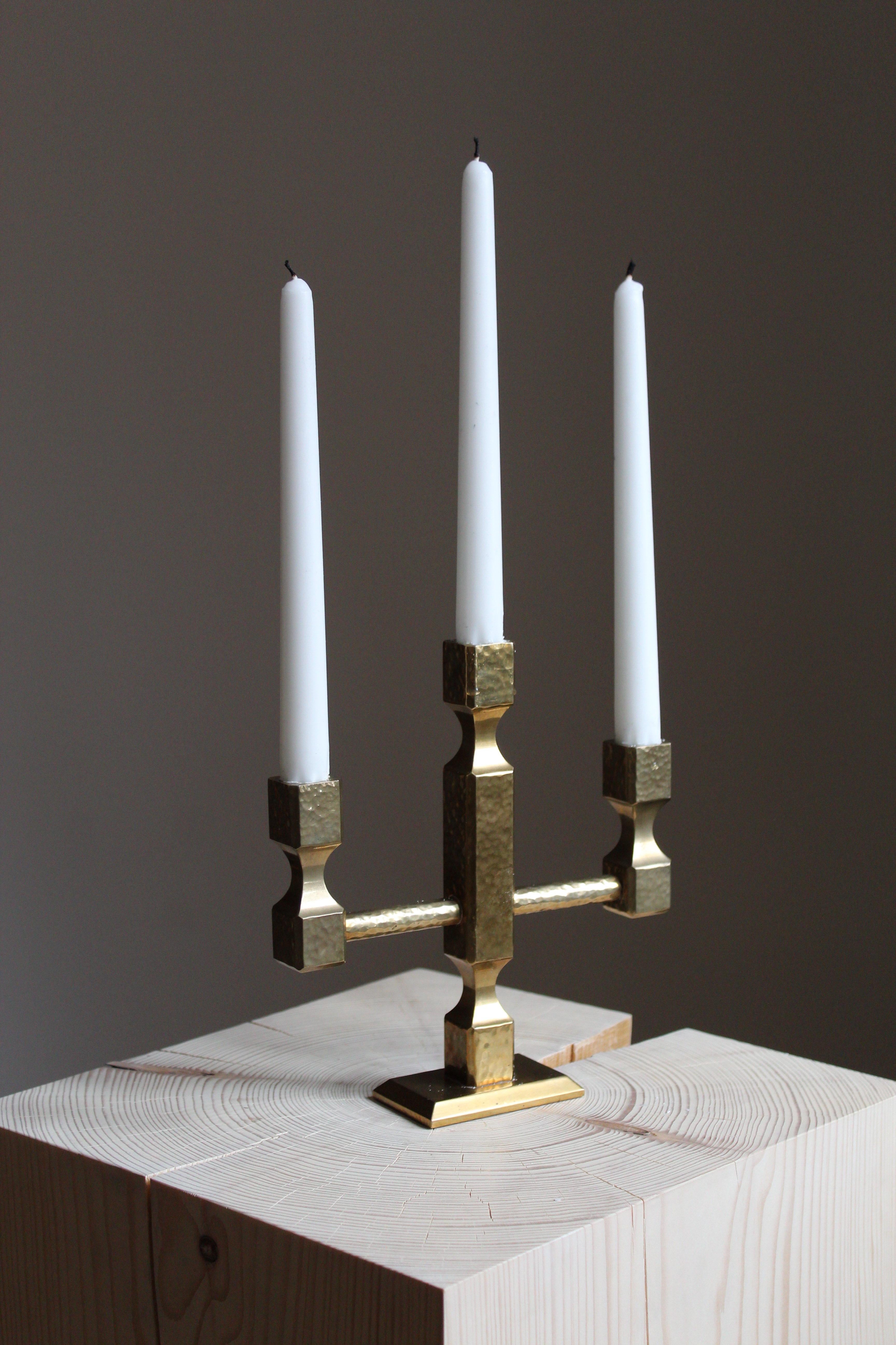 A candelabrum. Design and production by Metallslöjden Gusums Bruk, Sweden, 1970s. In heavy alloy brass.