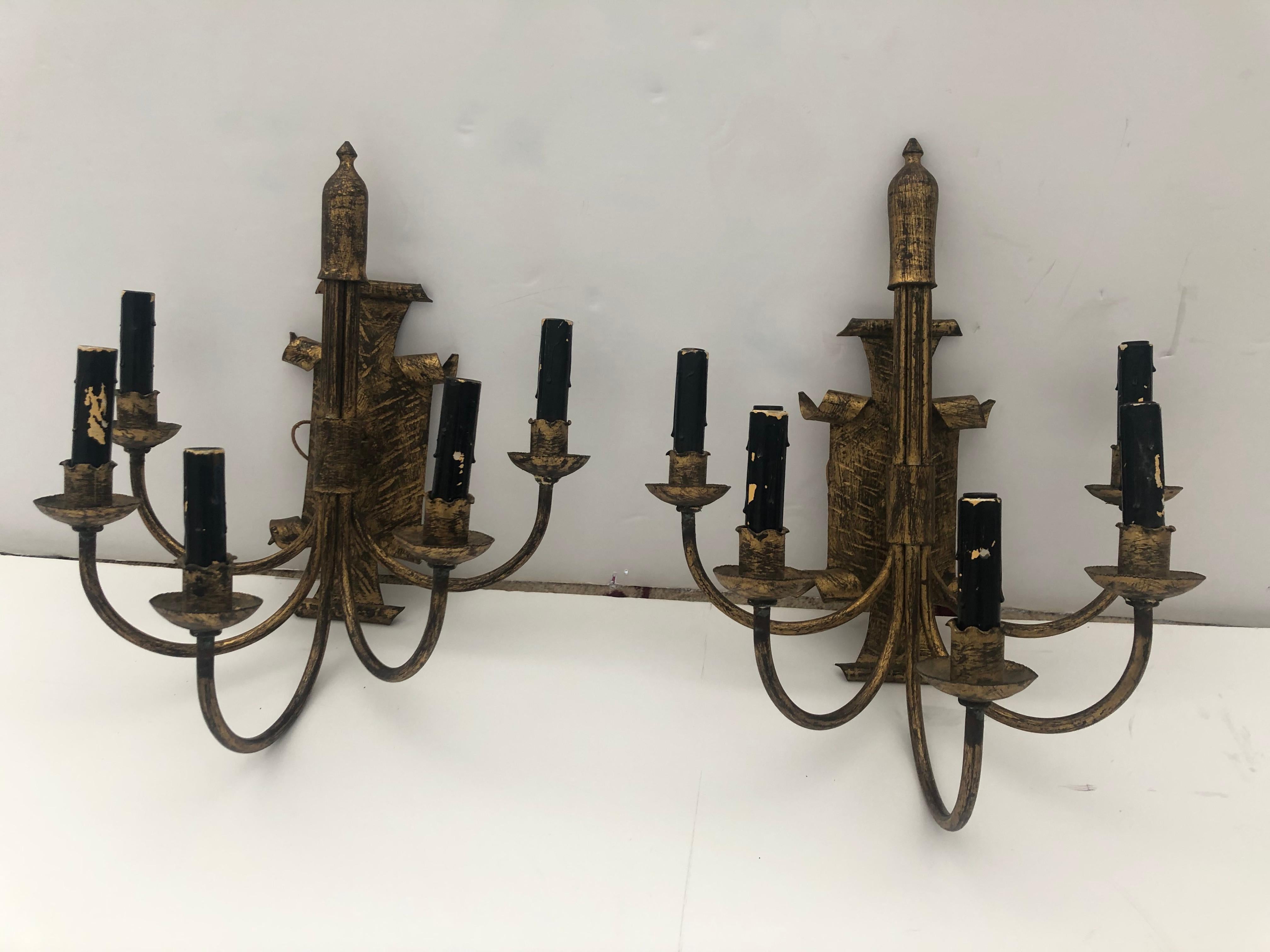 Unusual and striking pair of handsome 5-arm electrified candle sconces having bronze and black rubbed iron with shield style backs decorative regal finials.