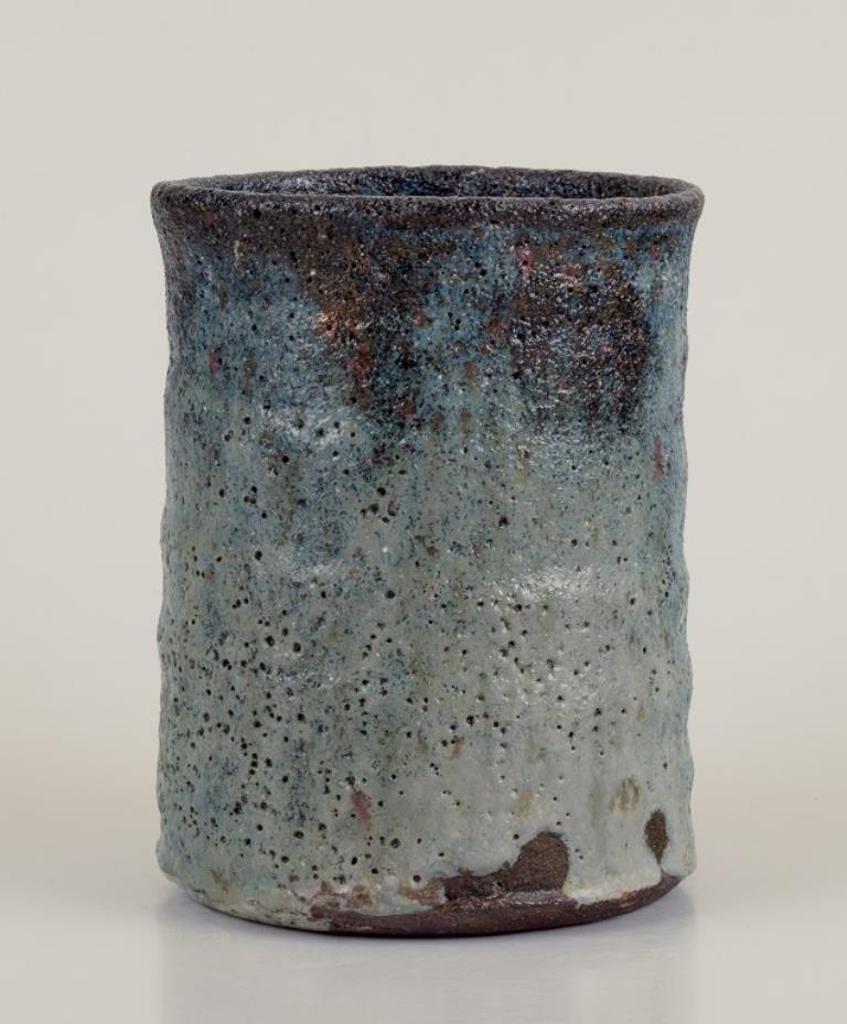 Danish Gutte Eriksen, Denmark. Vase in ceramic, raku technique, flowing lava glaze For Sale