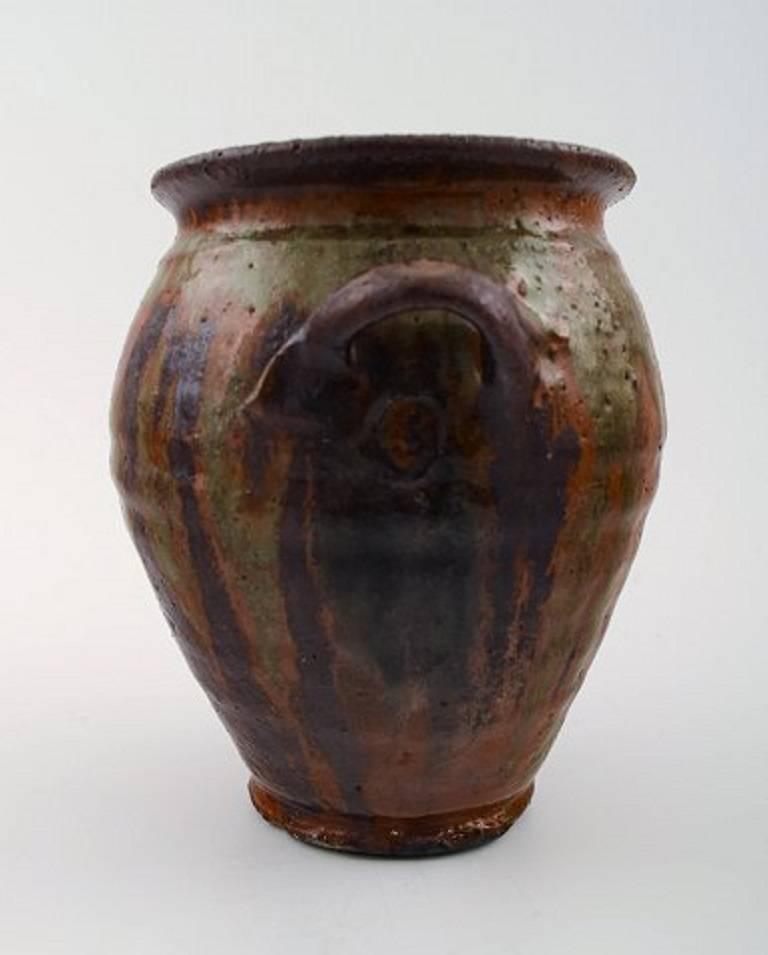 Gutte Eriksen, own workshop, pottery vase with handles.
Denmark, mid-20th century
Marked.
Measures: 15 x 15 cm.
In perfect condition.