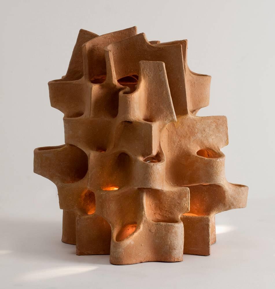 Unique piece
Signed: Bareff

Bareff is inspired particularly by architecture, and interested in clay for its warmth of color and the tactility of its raw texture. The central dialogue of his work is the dynamic interplay of light and form in