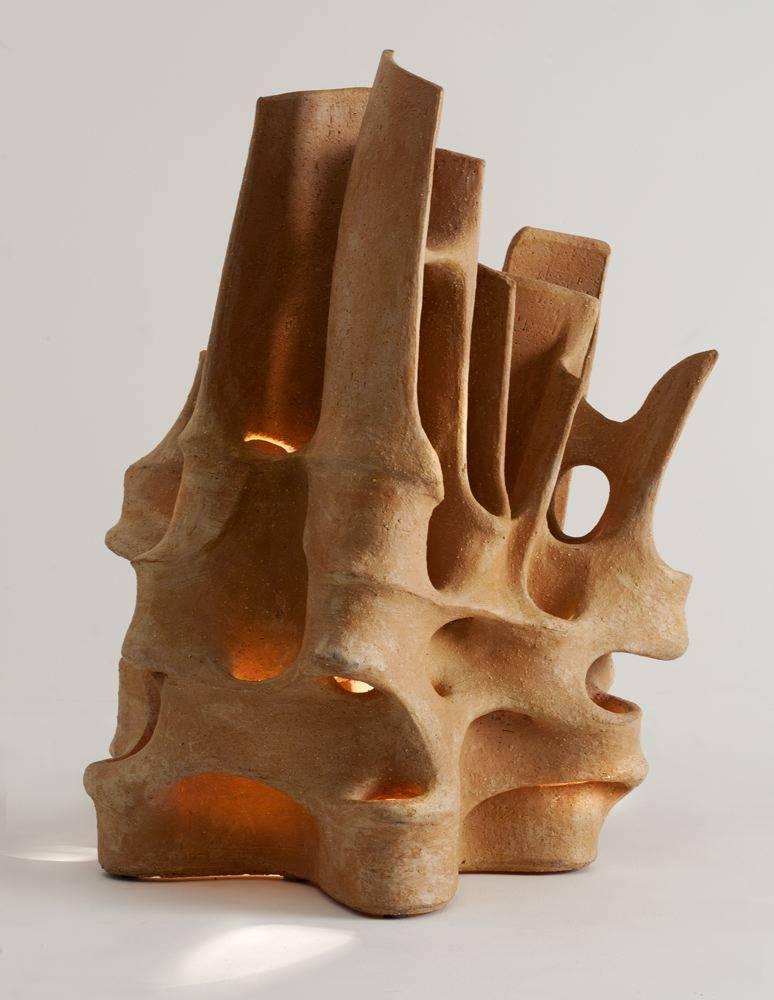Unique piece
Signed: Bareff

Bareff is inspired particularly by architecture, and interested in clay for its warmth of color and the tactility of its raw texture. The central dialogue of his work is the dynamic interplay of light and form in