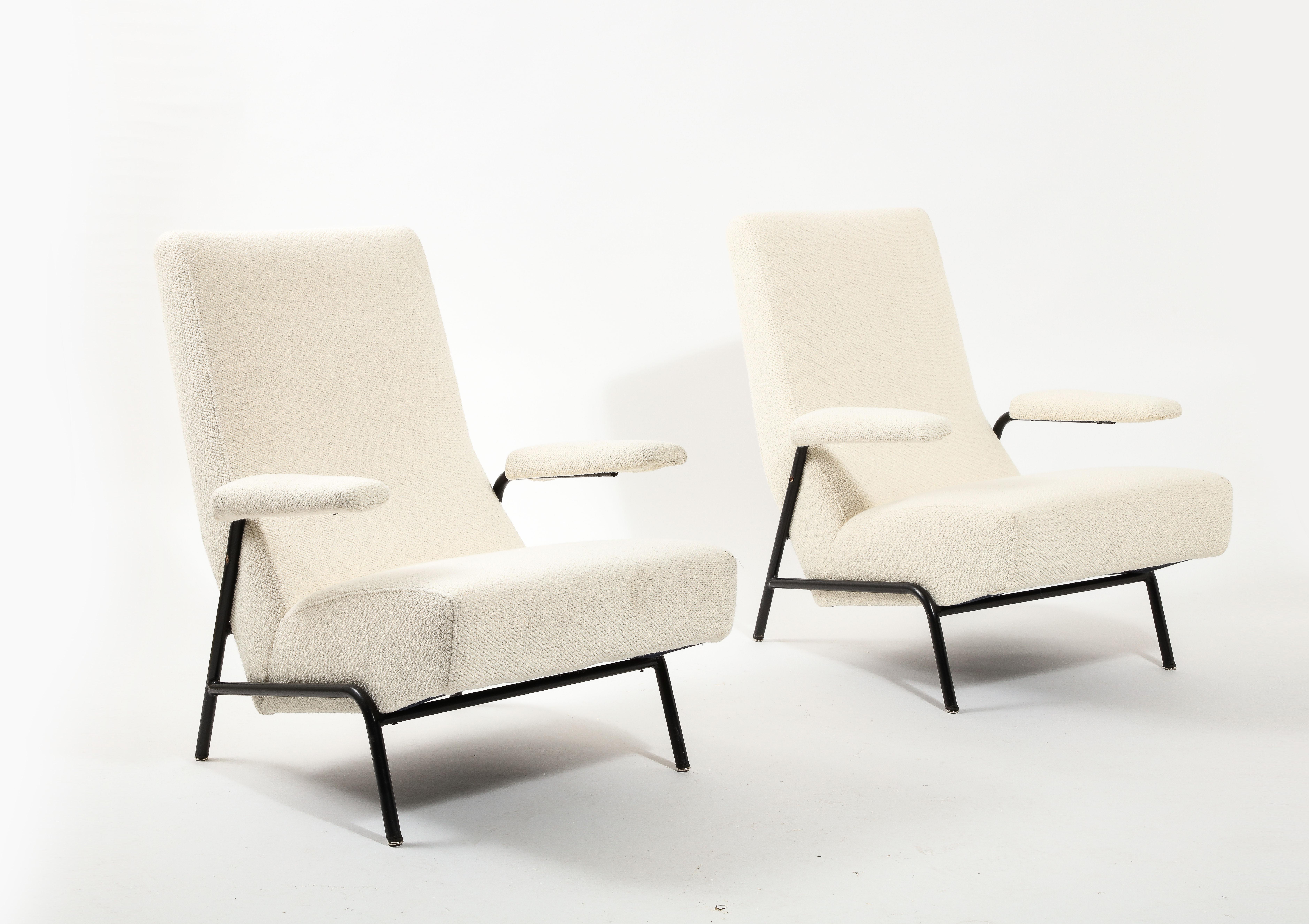 Pair of Guy Besnard armchairs on an enameled steel base, newly reupholstered in bouclé.