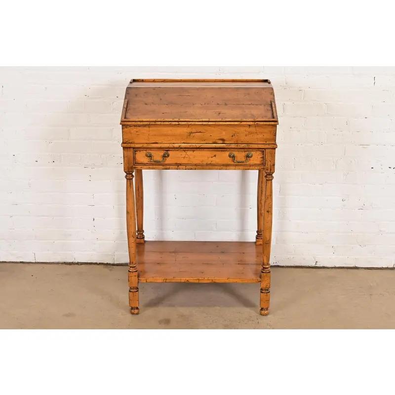 A gorgeous Swedish Gustavian or Rustic European style slant front secretary desk

By Guy Chaddock & Co.

USA, Late 20th Century

Carved solid maple, with original brass hardware.

Measures: 25.5