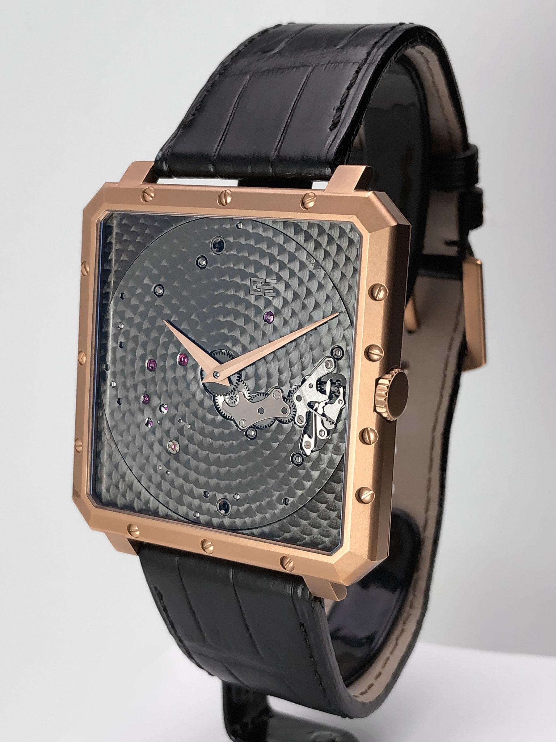 18 Karat Rose Gold Time Space Square
Reference #OR-TSP-2315
Made in Switzerland
Manual Wind
Case #002
Anthracite engine turned main plate with rose gold hands
43mm square
Black Crocodile Strap with 18 KT Rose Gold Tang Buckle
Box and Warranty 



