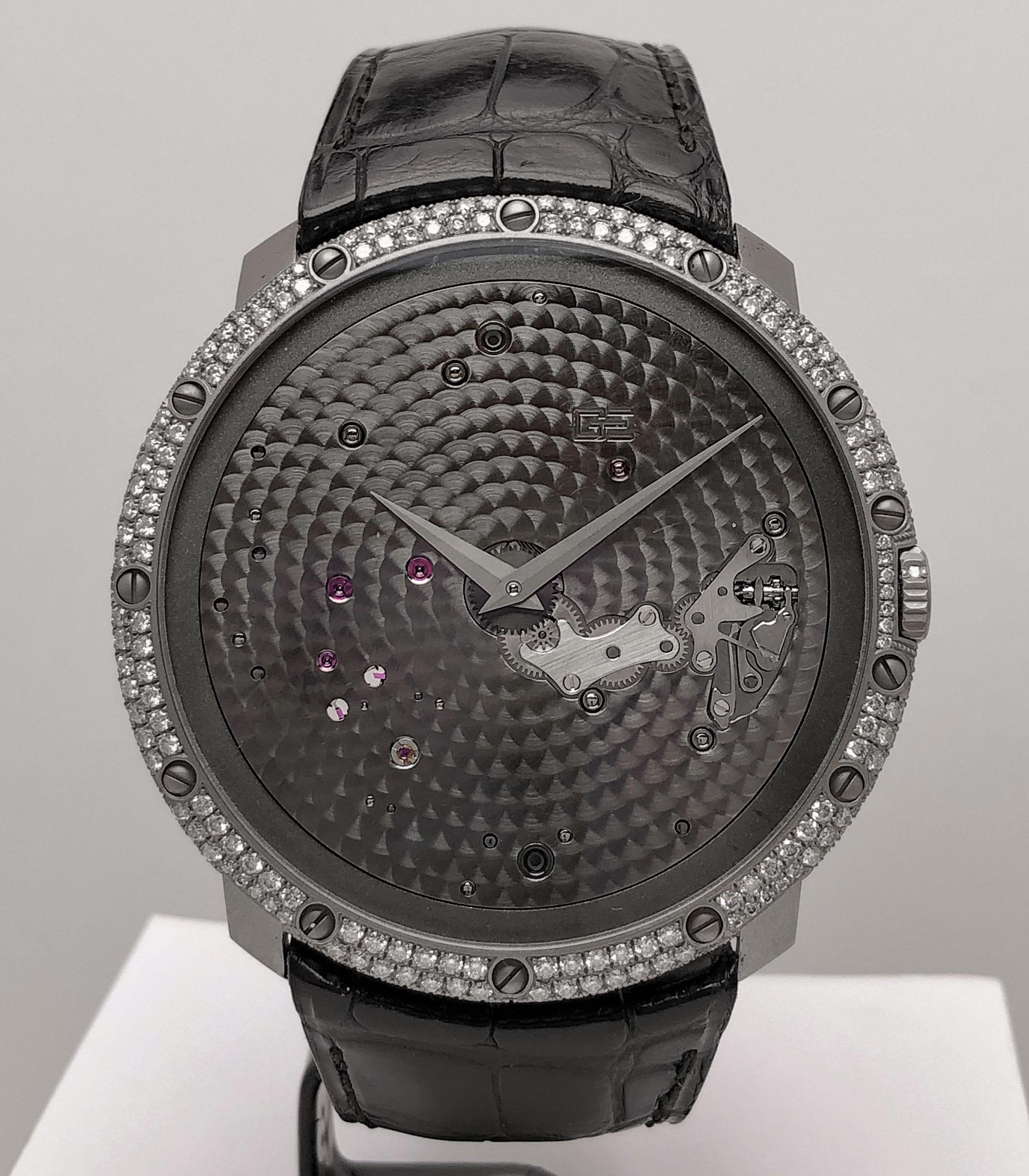 18Kt White Gold and Diamond Time Space
Reference # OG-RS-2388 LV1
Manual Wind
46.8 mm diameter
56 diamonds
43 hour power reserve
30 meters water resistant
Black  crocodile strap with 18kt white gold and diamond tang buckle
Box and warranty
