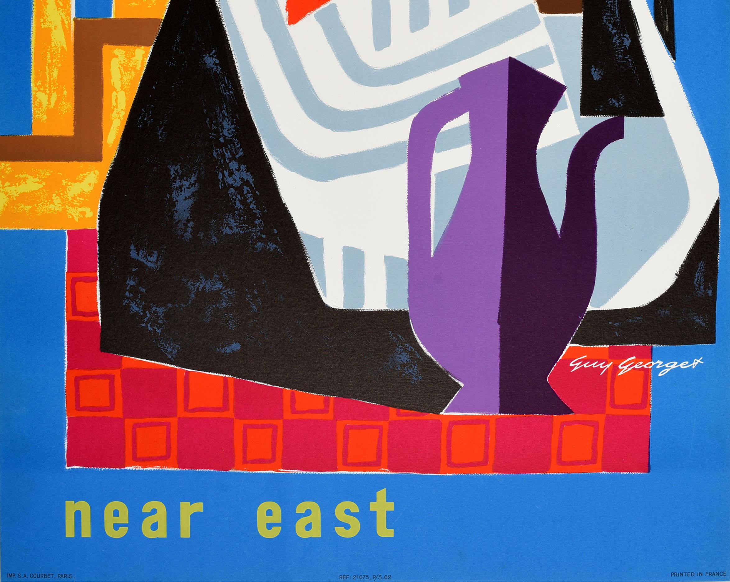 Original vintage travel advertising poster for Air France Near East featuring a colourful image by Guy Georget (1911-1992) of a figure in traditional clothing with minarets and an oil rig in the background. Excellent condition, restored small tears,