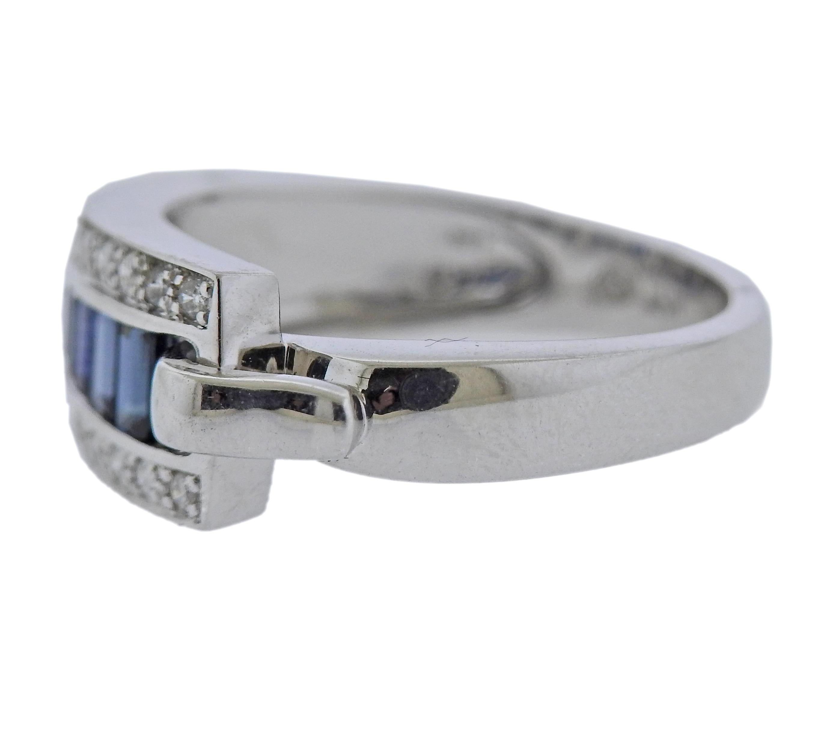 Bague Guy Laroche en or 18k avec saphir et environ 0,14ctw en diamants. Taille de l'anneau  6.75 (UE 54)  La partie supérieure est large de 8 mm. Marqué : Guy Laroche 18k. Poids 5,1 grammes.