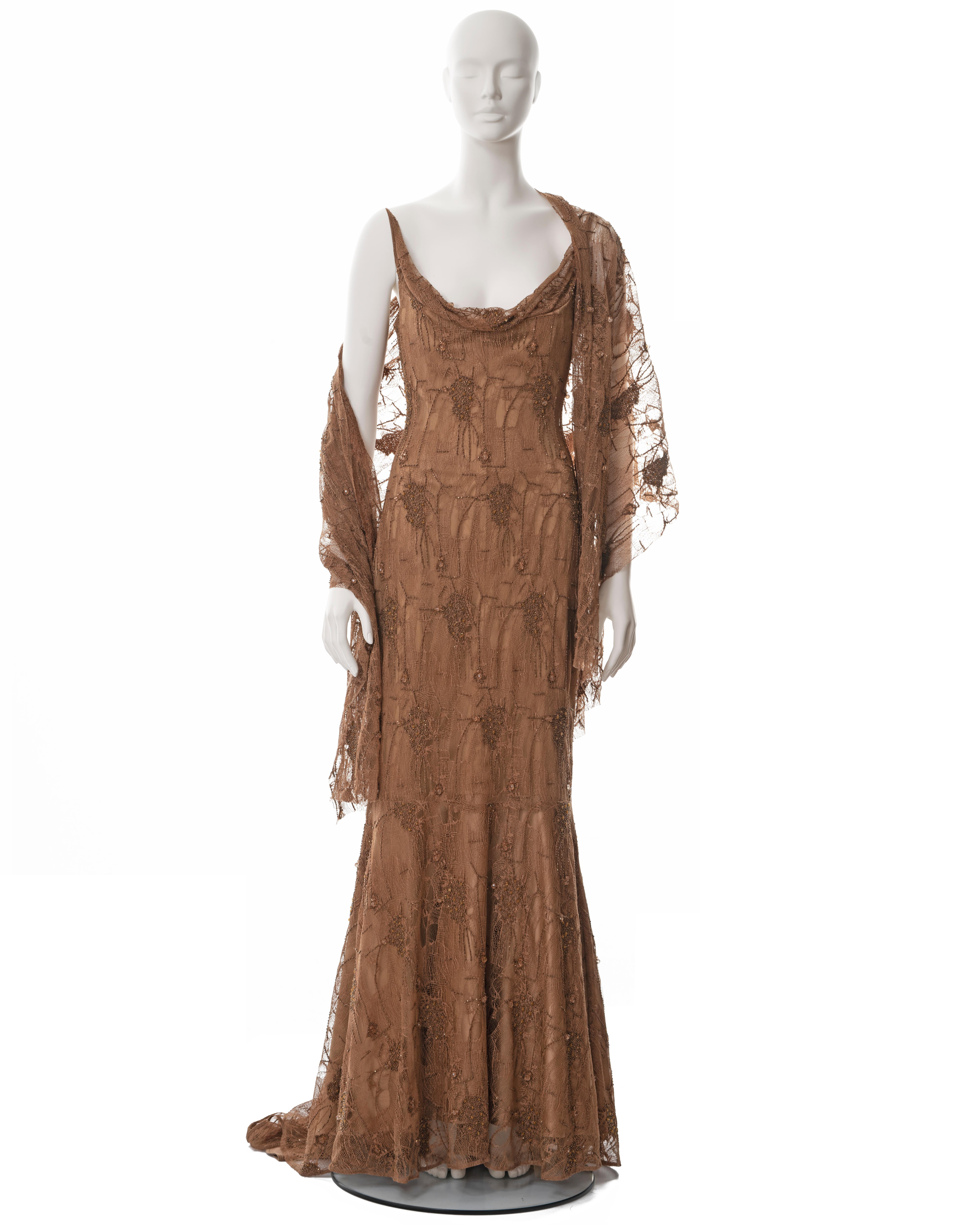 ▪ Guy Laroche copper beaded lace evening dress
▪ Designed by Laetitia Hecht
▪ Sold by One of a Kind Archive
▪ Fall-Winter 2002
▪ Cowl neck 
▪ Built-in corset 
▪ Floor-length skirt with train 
▪ Matching beaded lace shawl 
▪ FR 44 - UK 14 - US 10
▪