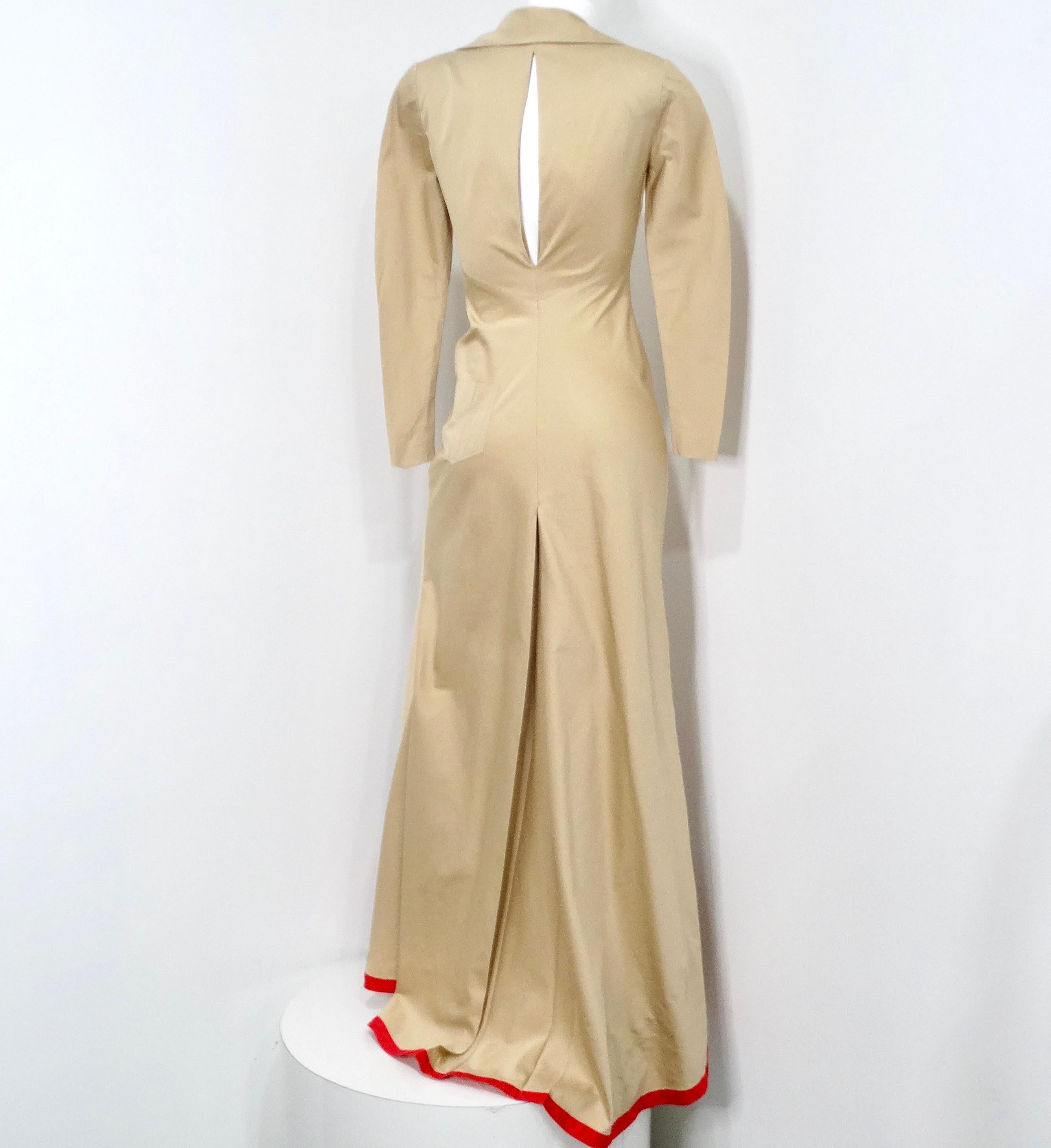 Guy Laroche Vintage Khaki Long-Sleeve Maxi Dress With Red Trim and Open Back Is a stunning piece that effortlessly blends classic elegance with contemporary flair. This dress features a refined collar and button closure remiaiscent of a tailored