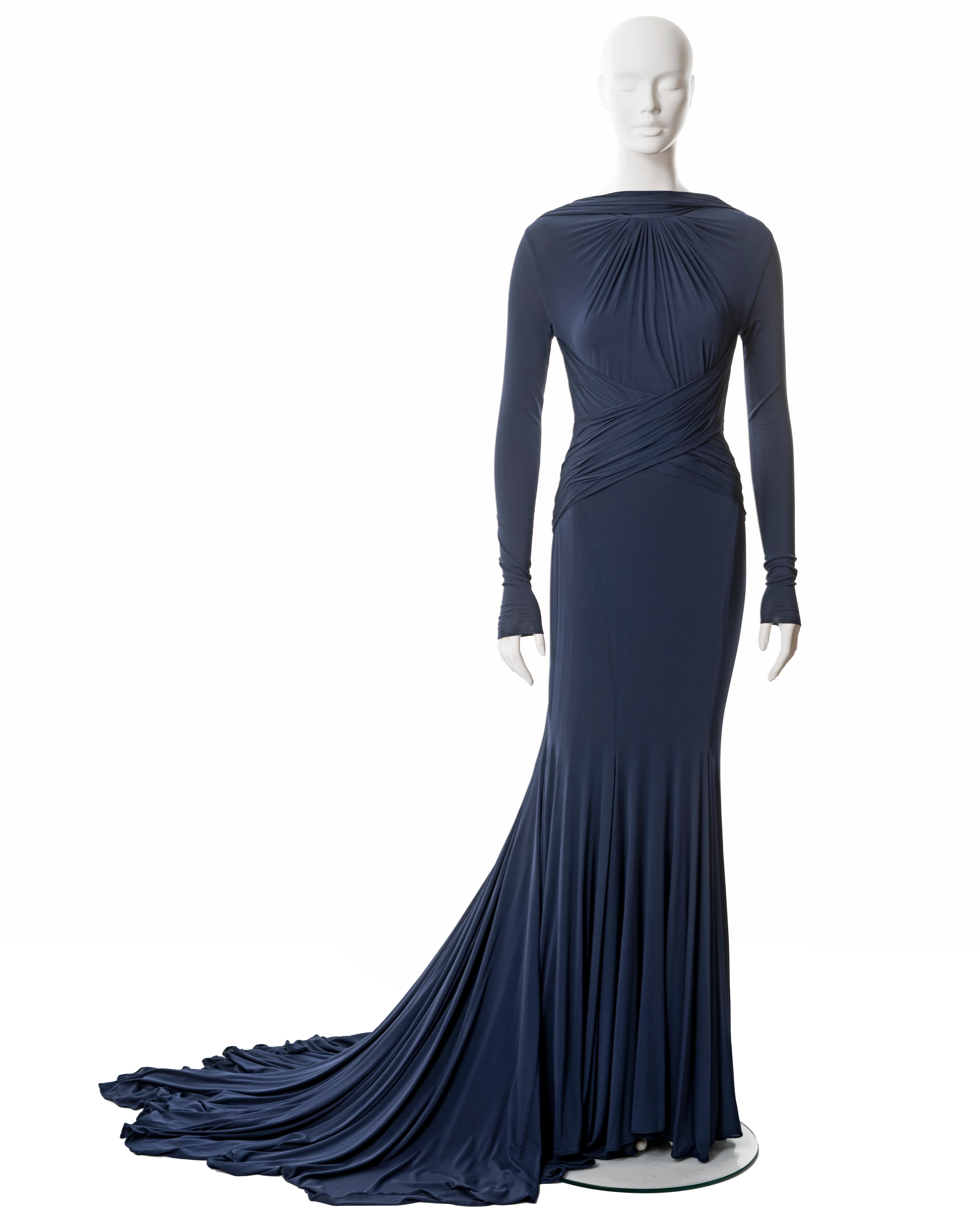 ▪ Guy Laroche navy blue Oscar dress
▪ Designed by Hervé L Leroux (Hervé Leger)
▪ Sold by One of a Kind Archive
▪ Spring-Summer 2005
▪ Constructed from 2 layers of navy blue viscose jersey
▪ Long fitted sleeves
▪ Open low back 
▪ Floor-length skirt